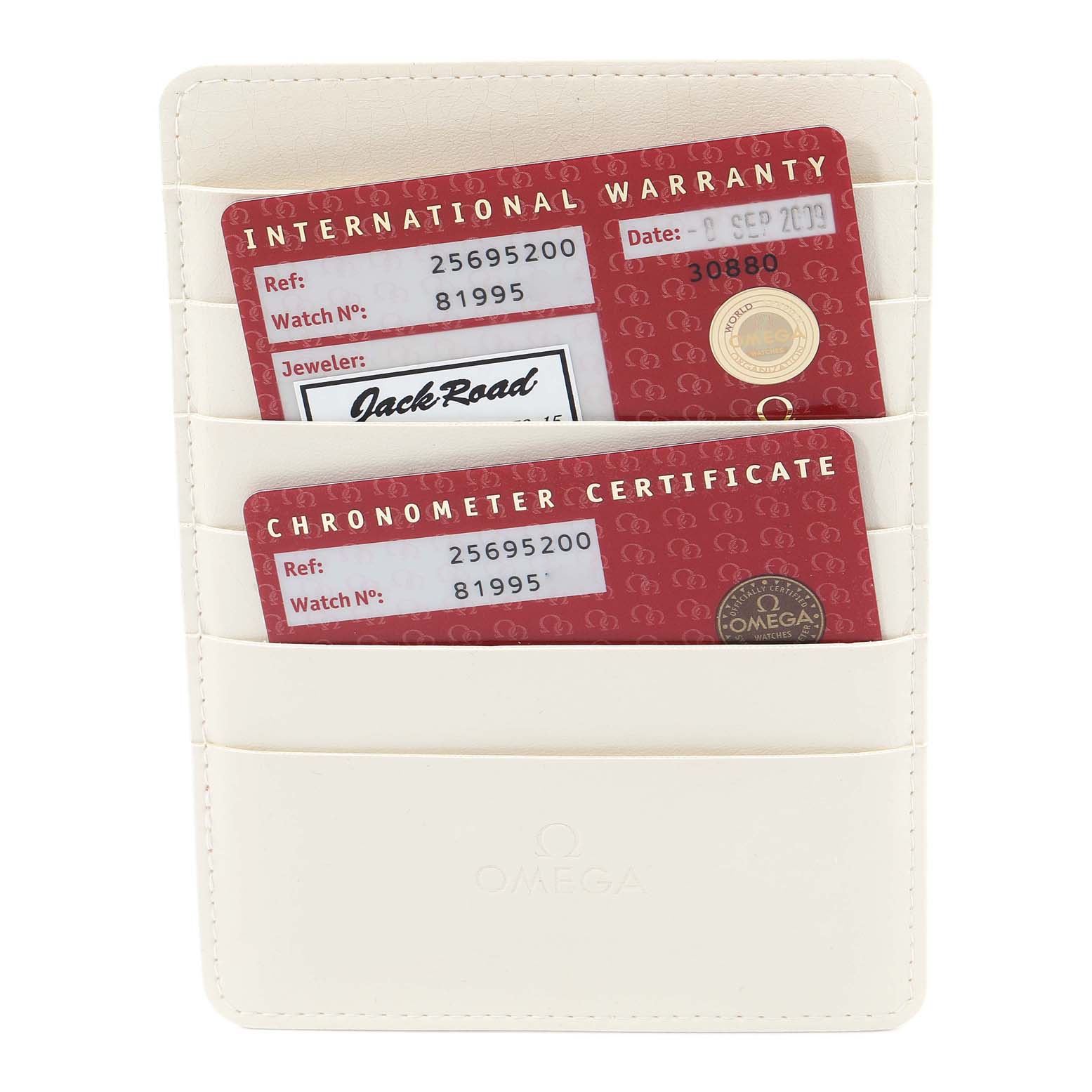 The image shows the International Warranty and Chronometer Certificate cards for the Omega Seamaster 2569.52.00 Men's Stainless Steel Black Dial 2569.52.00 Men's Stainless Steel Black Dial, held in a white cardholder.