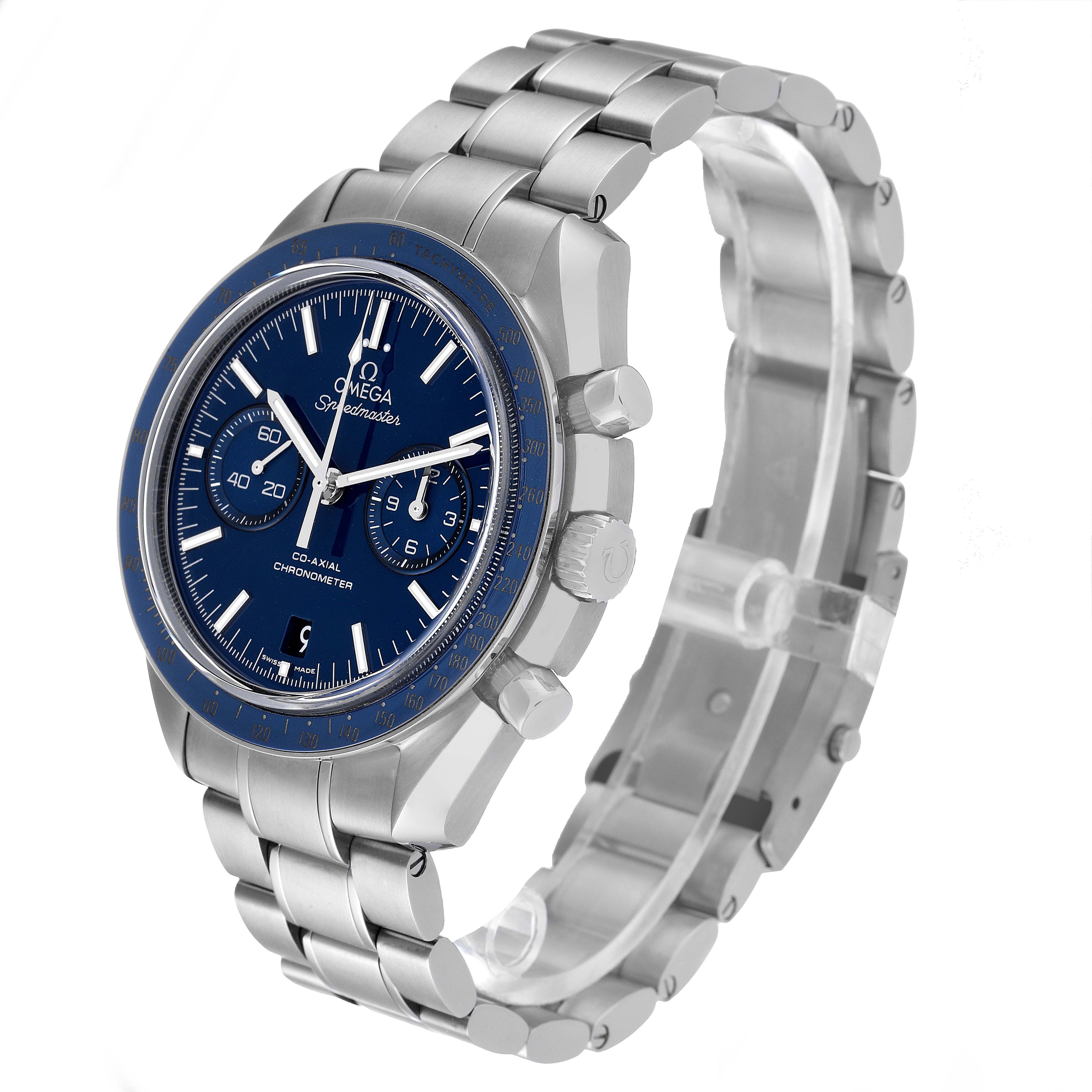 The Omega Speedmaster 311.90.44.51.03.001 Men's Titanium Blue Dial 311.90.44.51.03.001 Men's Titanium Blue Dial watch is shown at an angled side view, highlighting the face, bezel, and stainless steel bracelet.