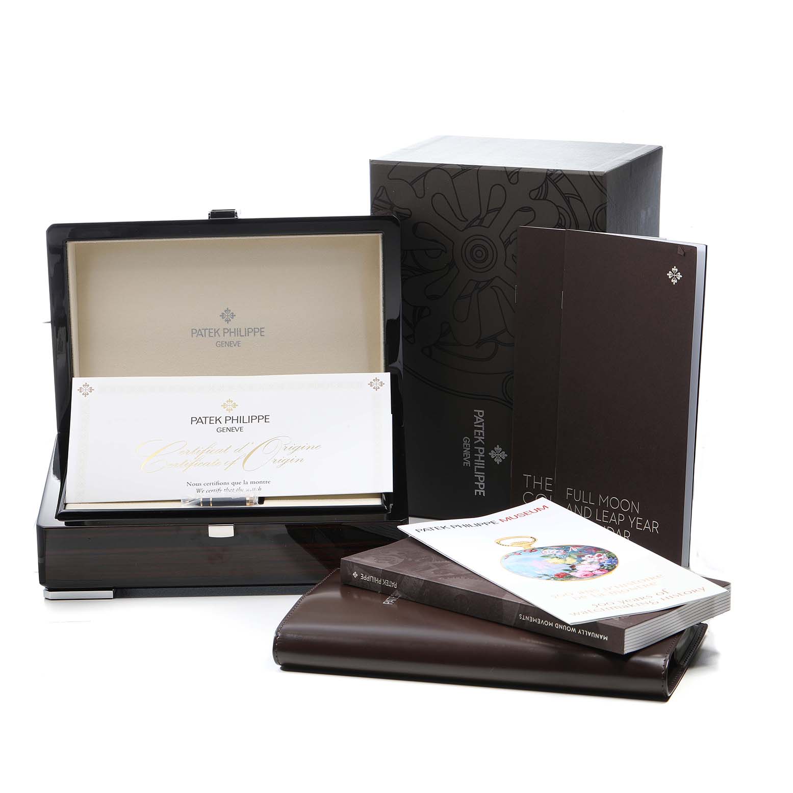 The image shows the packaging and documentation for a Patek Philippe Calatrava 7121J-001 Women's Yellow Gold Silver Dial, including a box, certificates, and booklets.