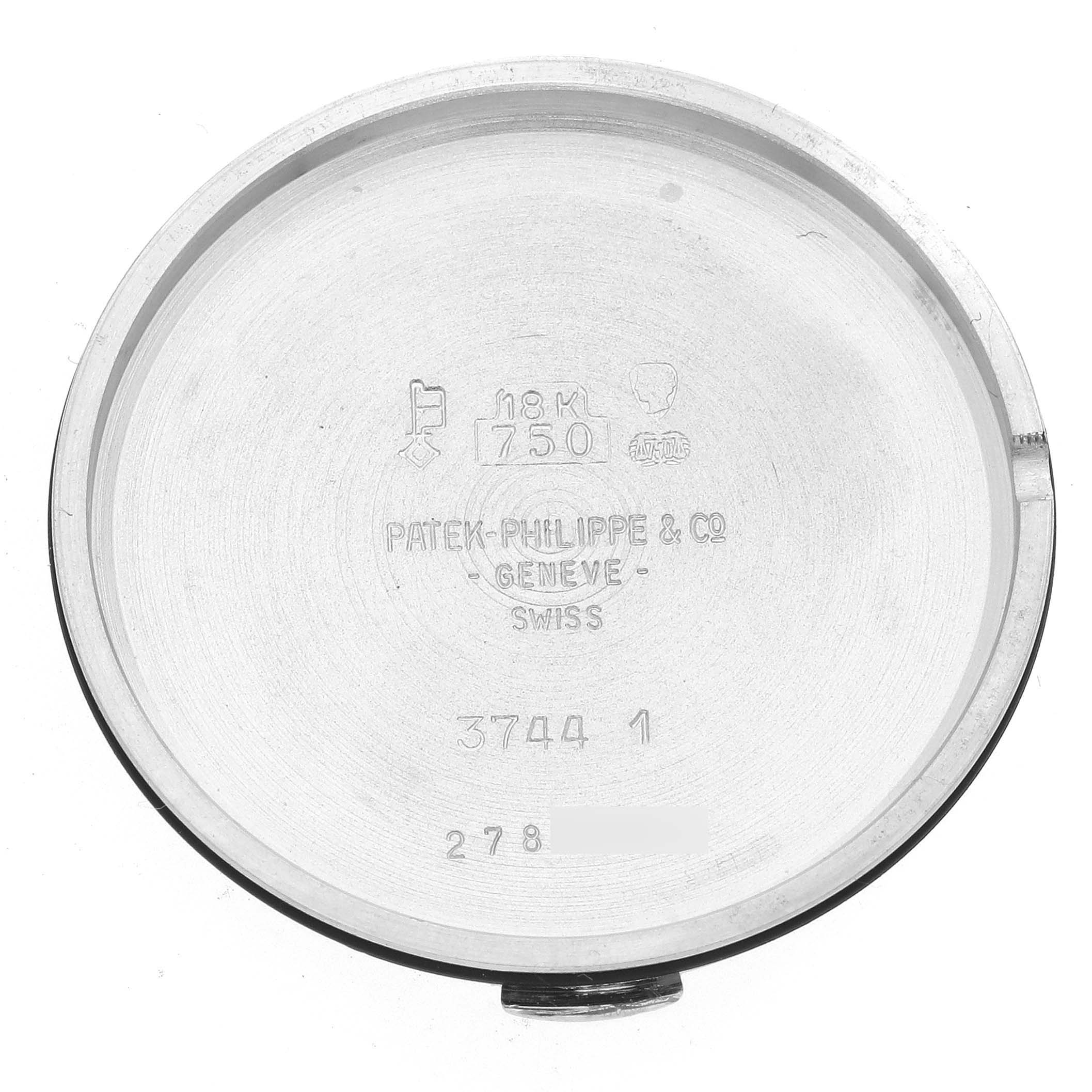 This image shows the inner case back of a Patek Philippe Calatrava 3744/1G Men's White Gold White Dial 3744/1G Men's White Gold White Dial watch, displaying engravings and hallmark stamps.