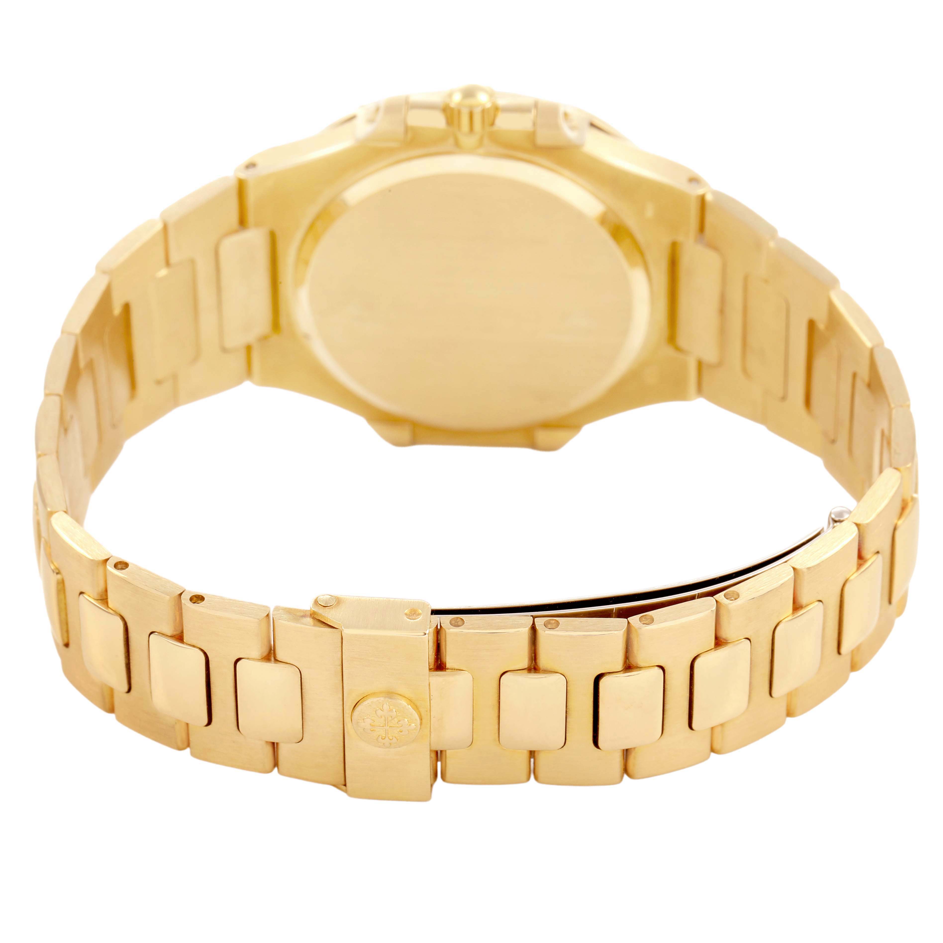 The image shows the back view of the Patek Philippe Nautilus 3900/1J Women's Yellow Gold Champagne Dial, highlighting the bracelet and clasp.