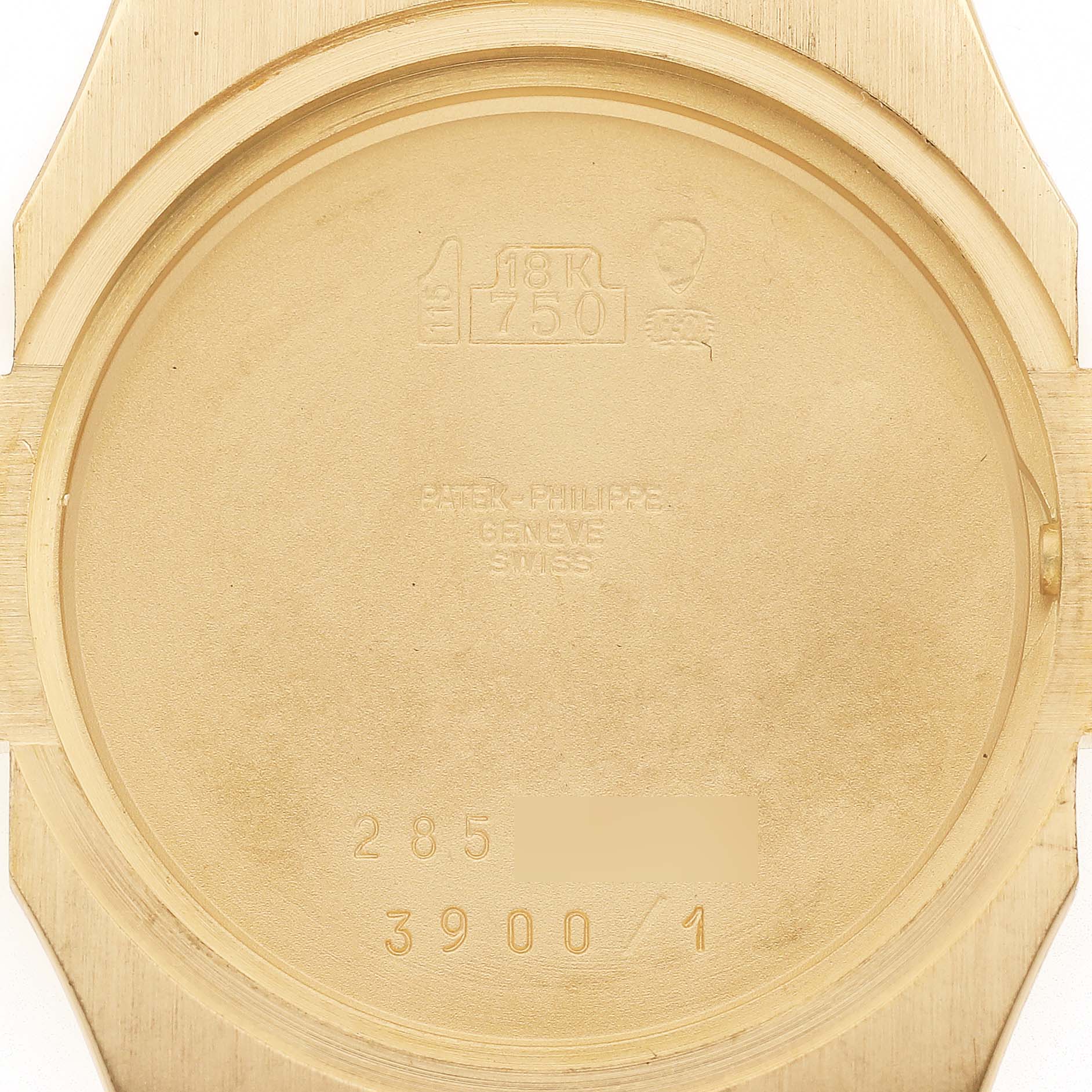 The image shows the back case interior of a Patek Philippe Nautilus 3900/1J Women's Yellow Gold Champagne Dial watch with engravings and hallmark.
