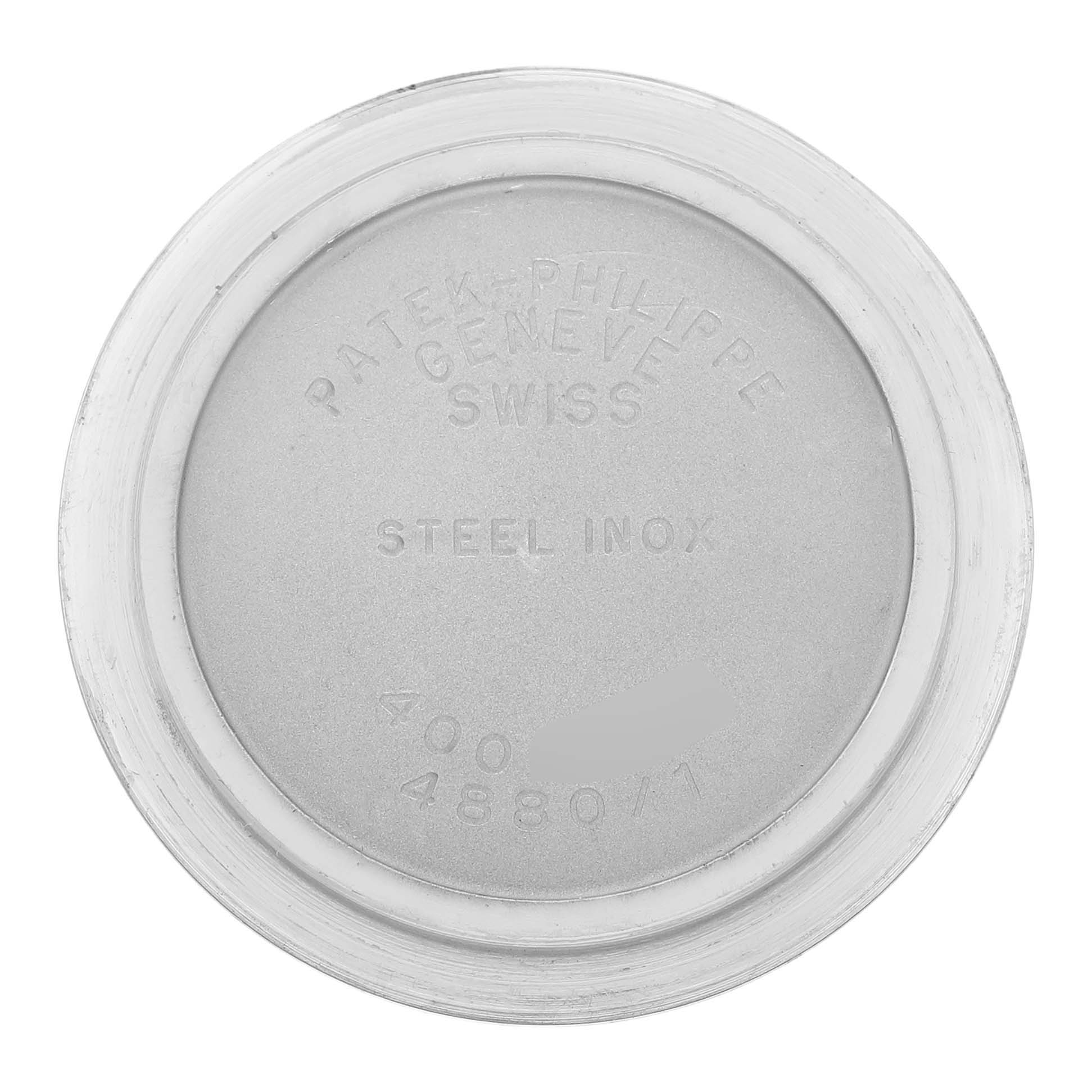 This image shows the inscribed case back of a Patek Philippe Neptune 4880/1JA Women's Steel and Gold (two tone) Black Dial watch, emphasizing its material and origin.