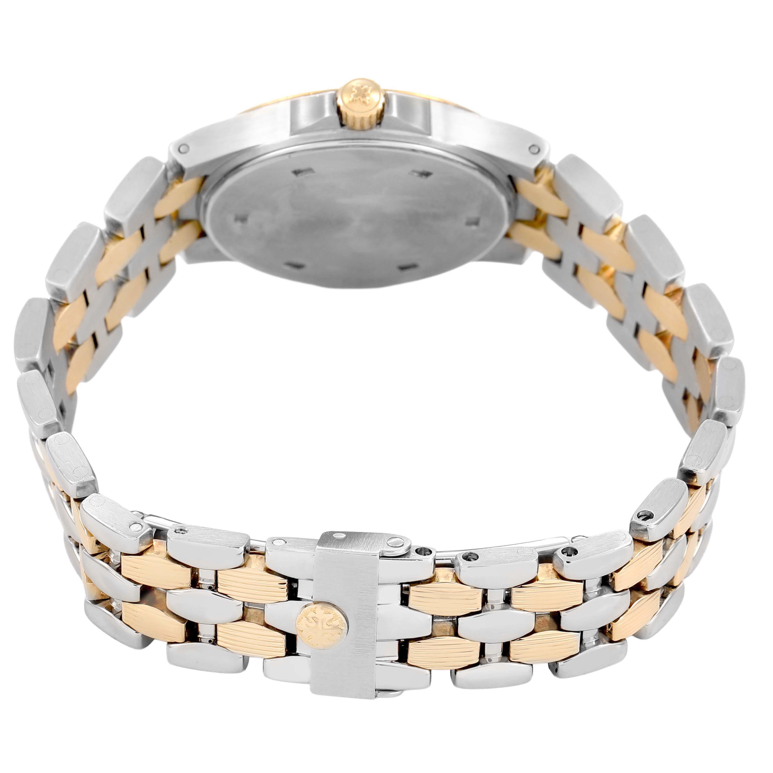 The Patek Philippe Neptune 4880/1JA Women's Steel and Gold (two tone) Black Dial watch is shown from a rear angle, displaying the back case, crown, and two-tone bracelet.