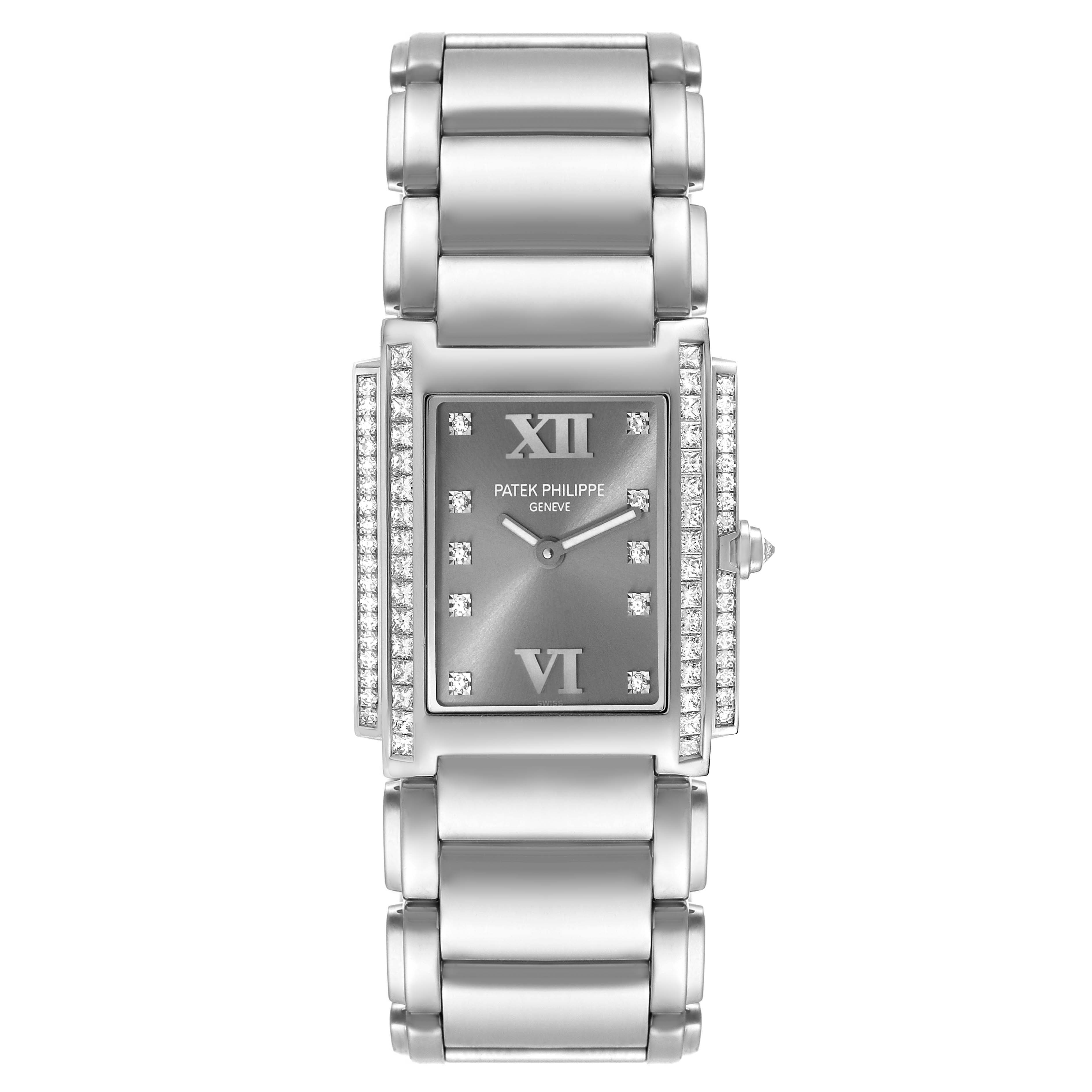 The Patek Philippe Twenty-4 4910/20 Women's White Gold Grey Dial 4910/20 Women's White Gold Grey Dial model watch is shown from a top-down angle, highlighting its dial, bezel with diamonds, and metal bracelet.