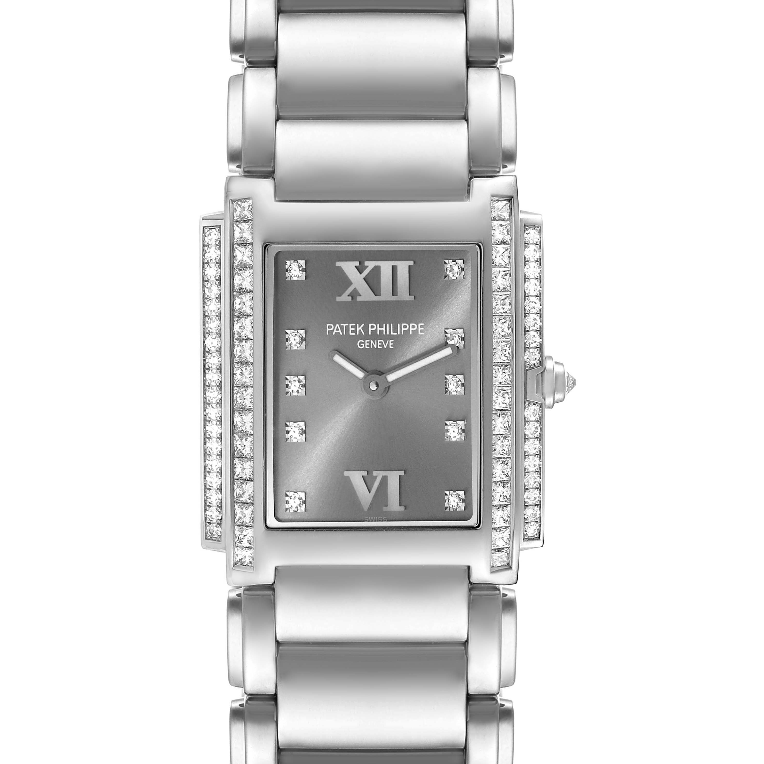 The image shows a front view of a Patek Philippe Twenty-4 4910/20 Women's White Gold Grey Dial 4910/20 Women's White Gold Grey Dial watch, highlighting its face, diamond accents, and metal bracelet.