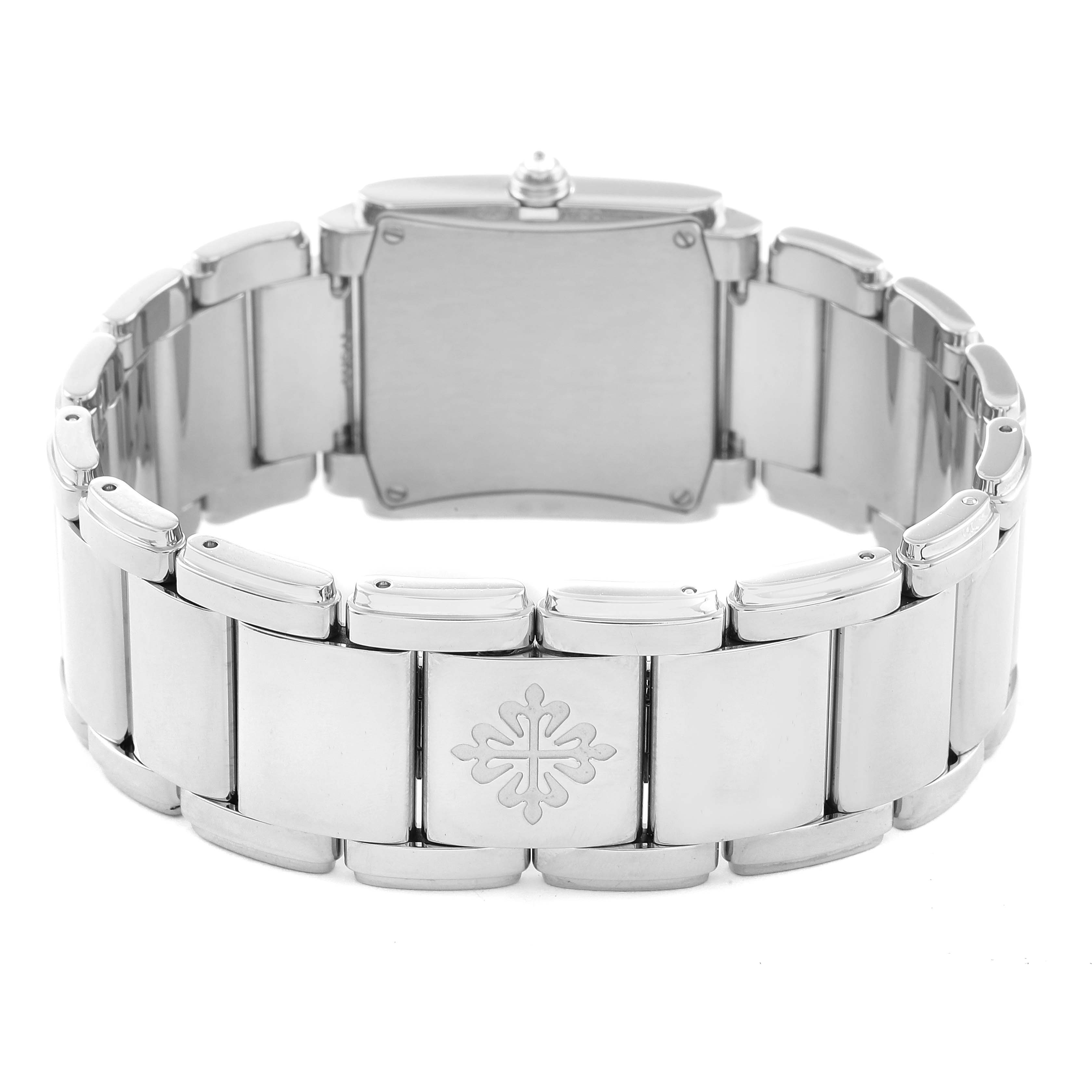 The image shows the back view of a Patek Philippe Twenty-4 4910/20 Women's White Gold Grey Dial 4910/20 Women's White Gold Grey Dial watch, highlighting its stainless steel bracelet and clasp with the brand's emblem.