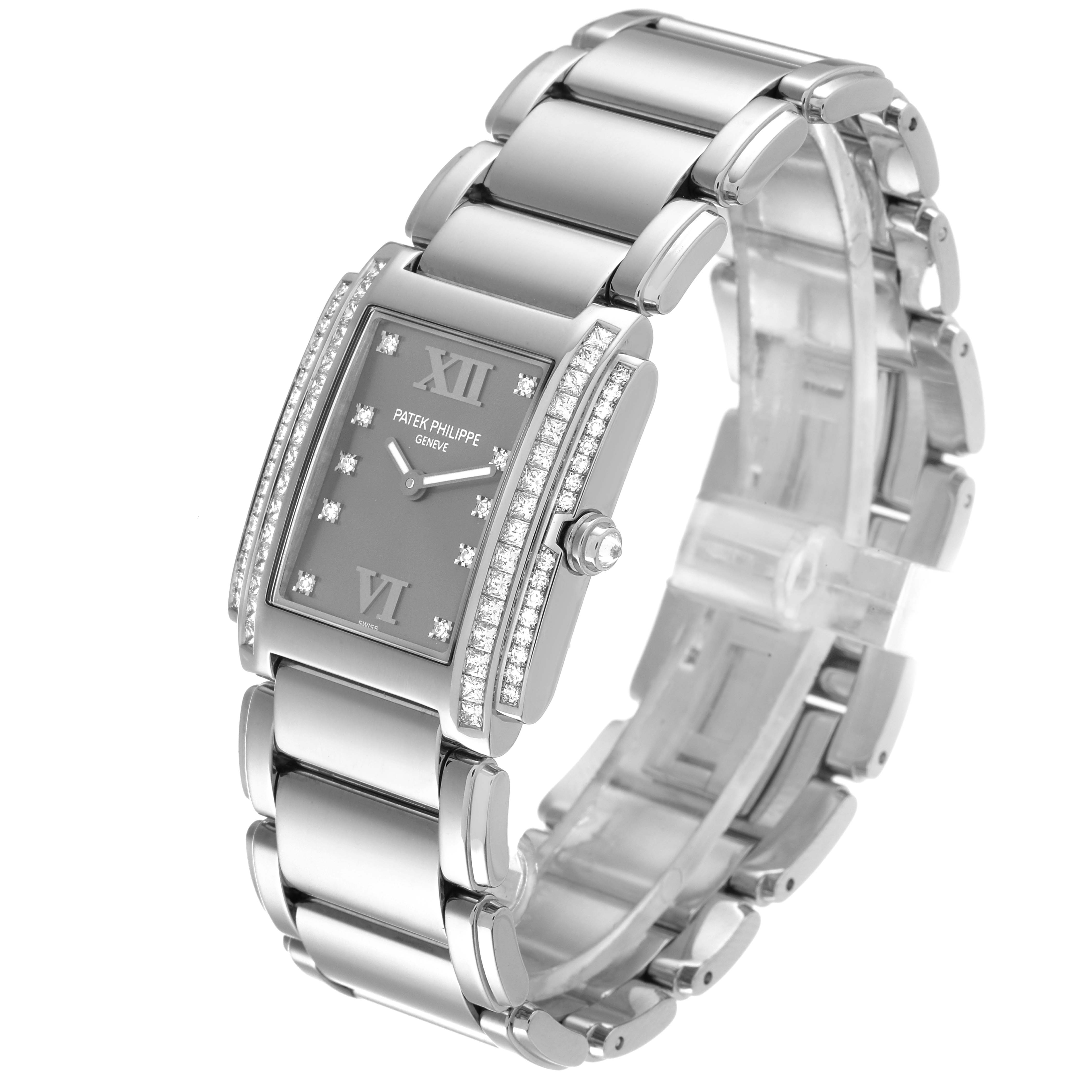The image shows a side angle view of a Patek Philippe Twenty-4 4910/20 Women's White Gold Grey Dial 4910/20 Women's White Gold Grey Dial watch, displaying its bracelet, case, crown, and diamond details.