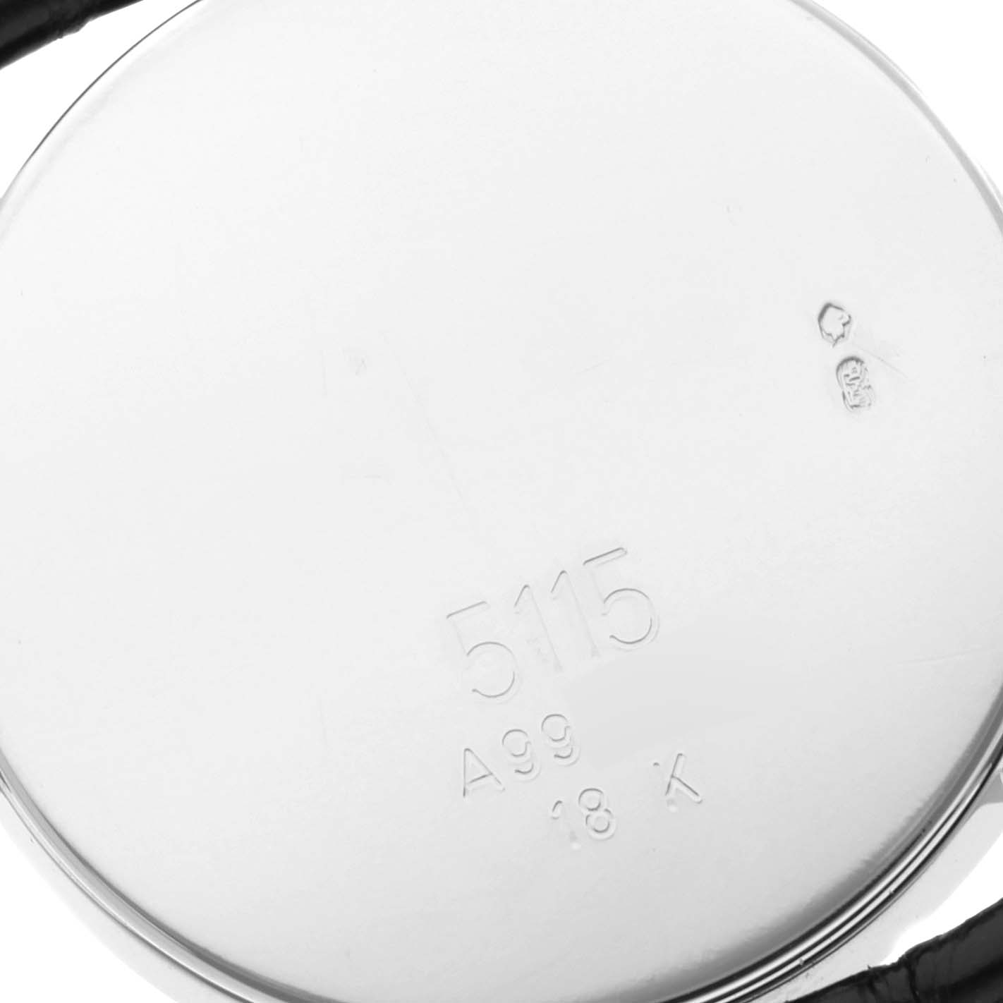 This image shows the back case of the Rolex Cellini 5115 Men's White Gold Mother of Pearl Dial 5115 Men's White Gold Mother of Pearl Dial model with inscriptions and stampings visible.