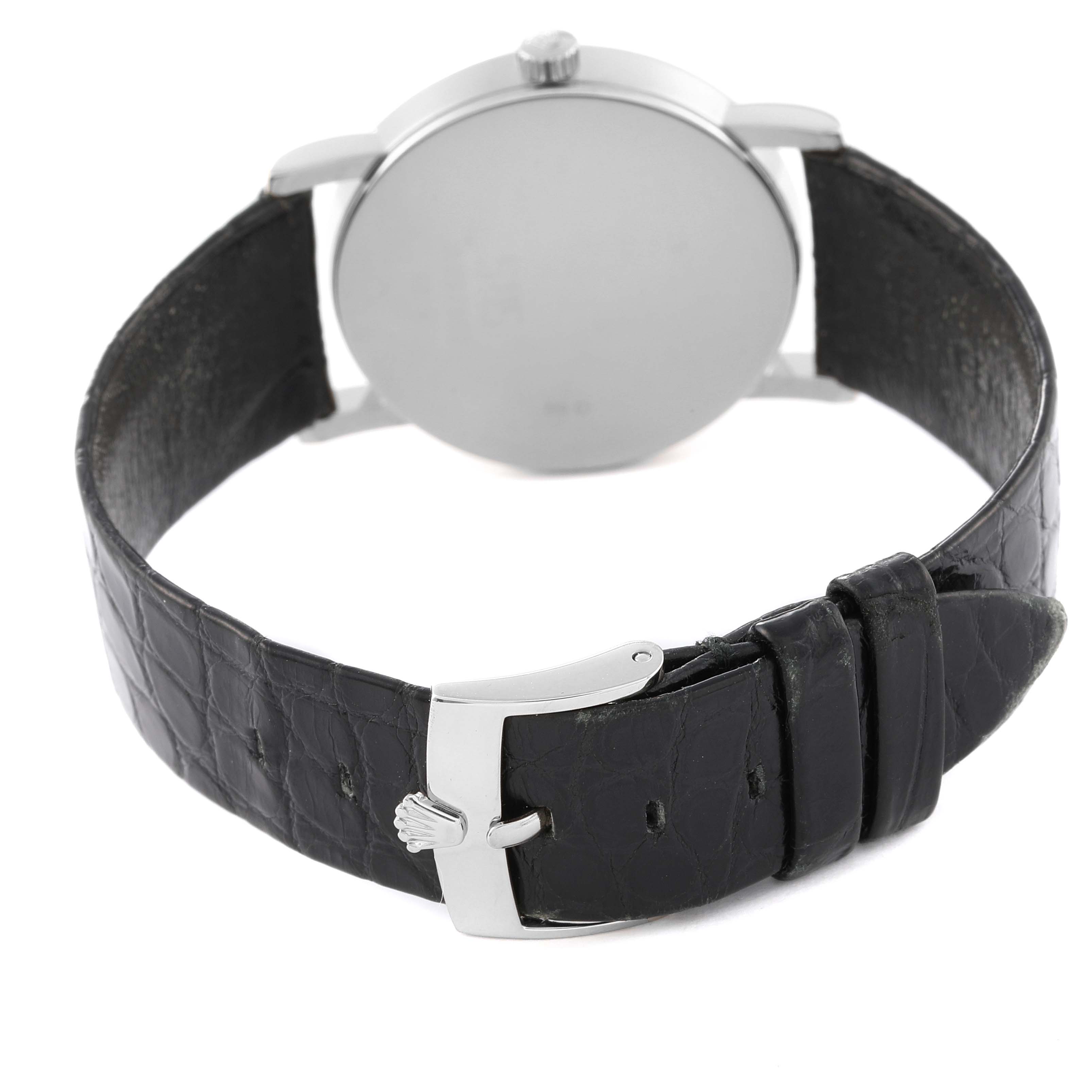 The image shows the back of a Rolex Cellini 5115 Men's White Gold Mother of Pearl Dial 5115 Men's White Gold Mother of Pearl Dial watch, including its black leather strap and buckle.