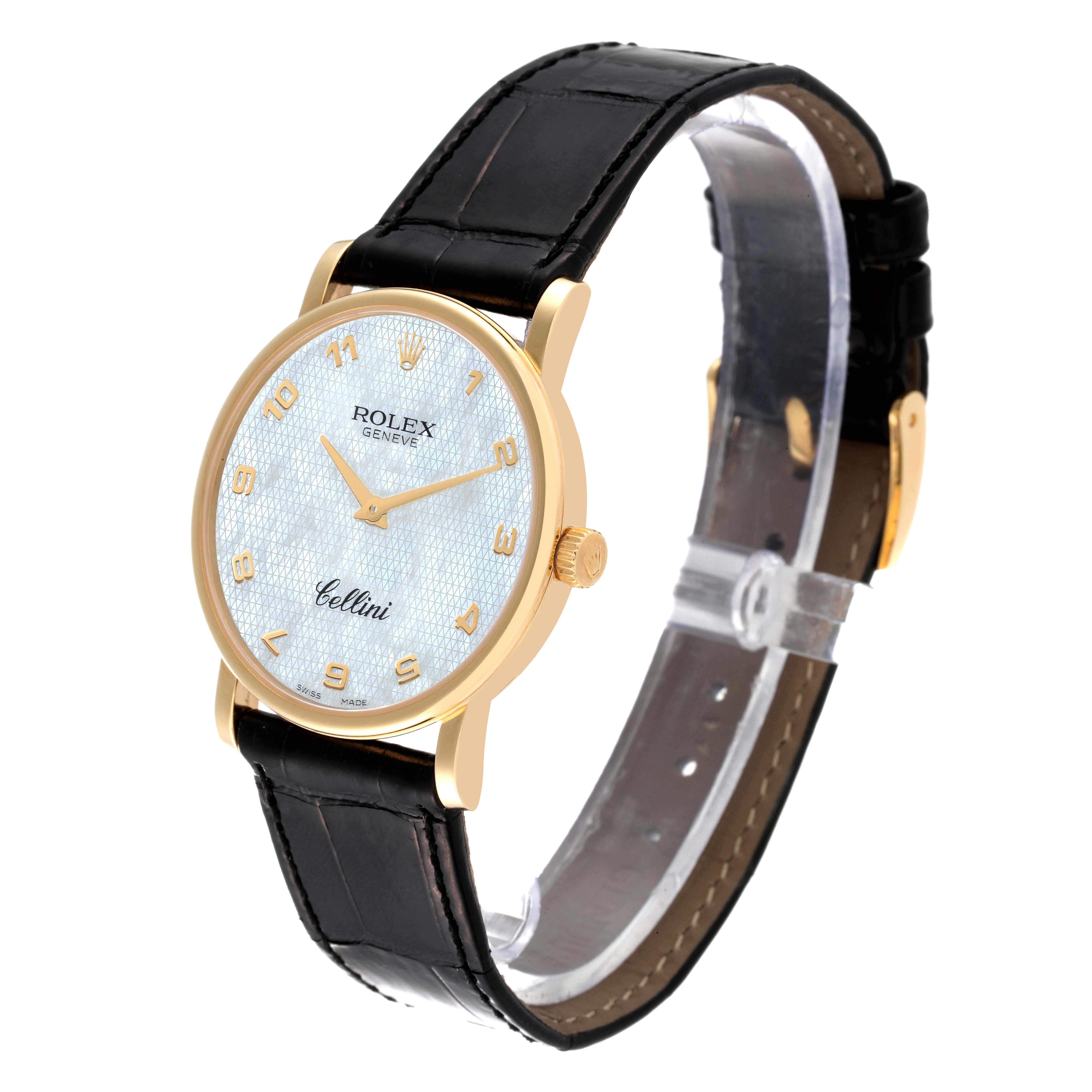The Rolex Cellini 5115 Men
s Yellow Gold Mother of Pearl Dial 5115 Men
s Yellow Gold Mother of Pearl Dial watch is shown at a slight angle, displaying its full dial, gold case, crown, and black leather strap.
