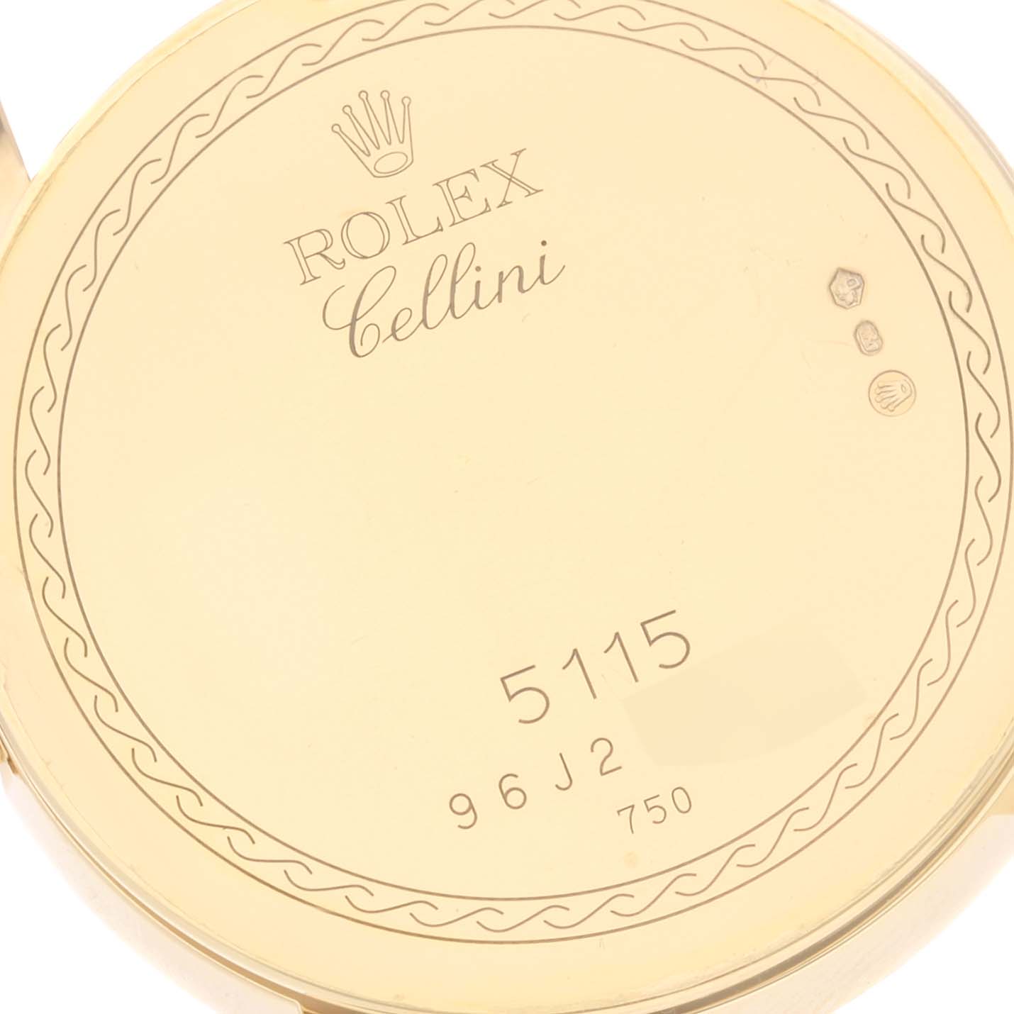 This image shows the back of a Rolex Cellini 5115 Men
s Yellow Gold Mother of Pearl Dial 5115 Men
s Yellow Gold Mother of Pearl Dial watch, displaying its model number and hallmark stamps.