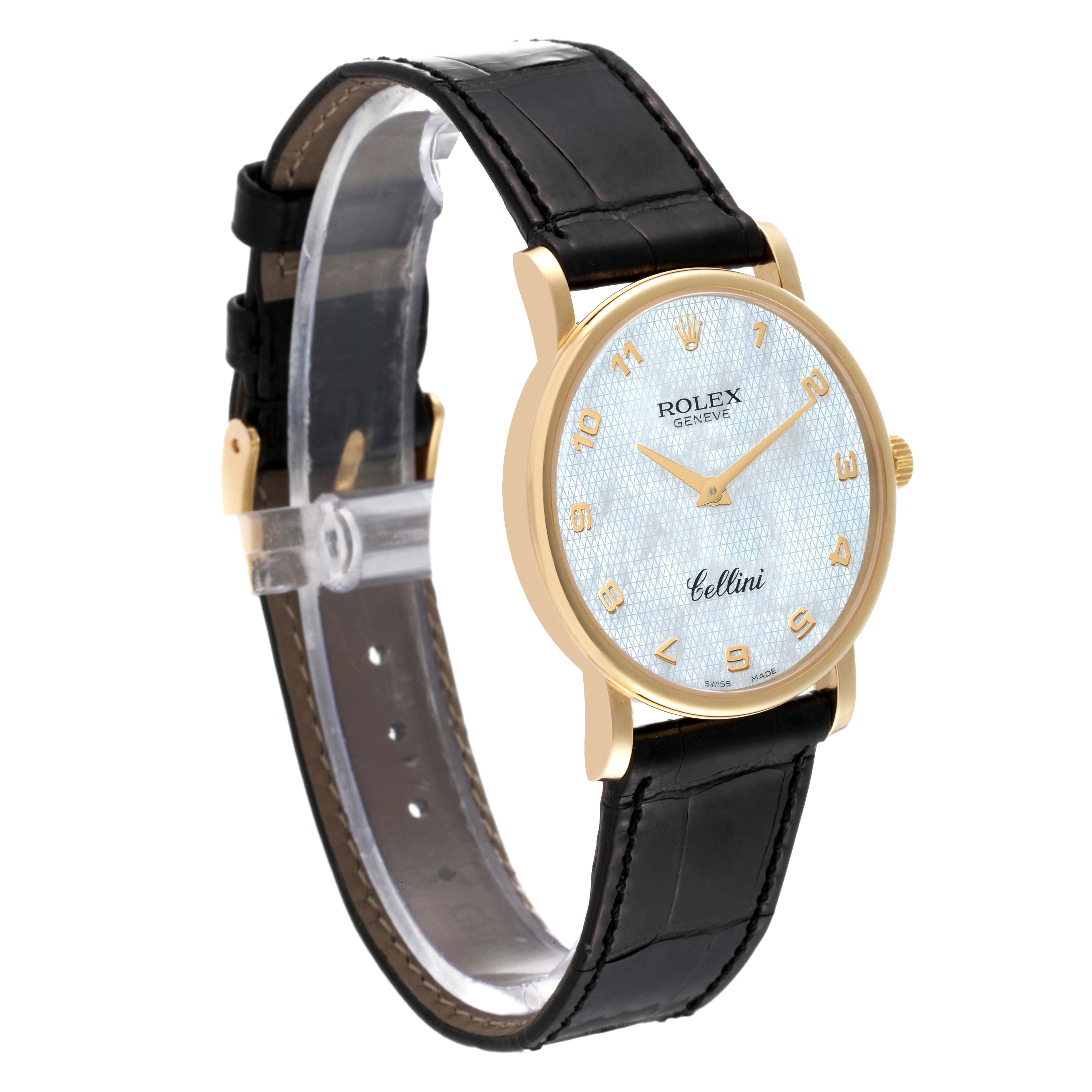 The image shows a side angle of a Rolex Cellini 5115 Men
s Yellow Gold Mother of Pearl Dial 5115 Men
s Yellow Gold Mother of Pearl Dial watch with a gold case and black leather strap.