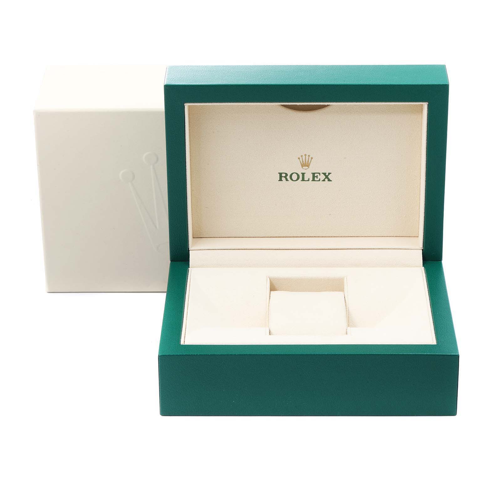 This image shows an open luxury box for a Rolex Daytona 116515LN Men's Rose Gold Silver Dial 116515LN Men's Rose Gold Silver Dial watch, highlighting the interior and exterior packaging.