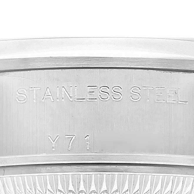 This image shows a close-up of the stainless steel case back of a Rolex Date 79160 Women
s Stainless Steel White Dial 79160 Women
s Stainless Steel White Dial model watch.