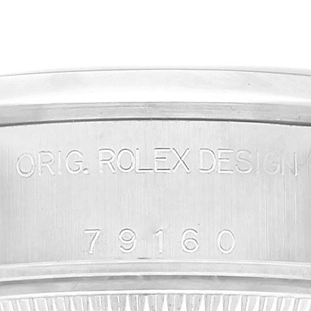 This image shows the side of a Rolex Date 79160 Women
s Stainless Steel White Dial 79160 Women
s Stainless Steel White Dial model, displaying the engraved case reference number and "ORIG. ROLEX DESIGN."