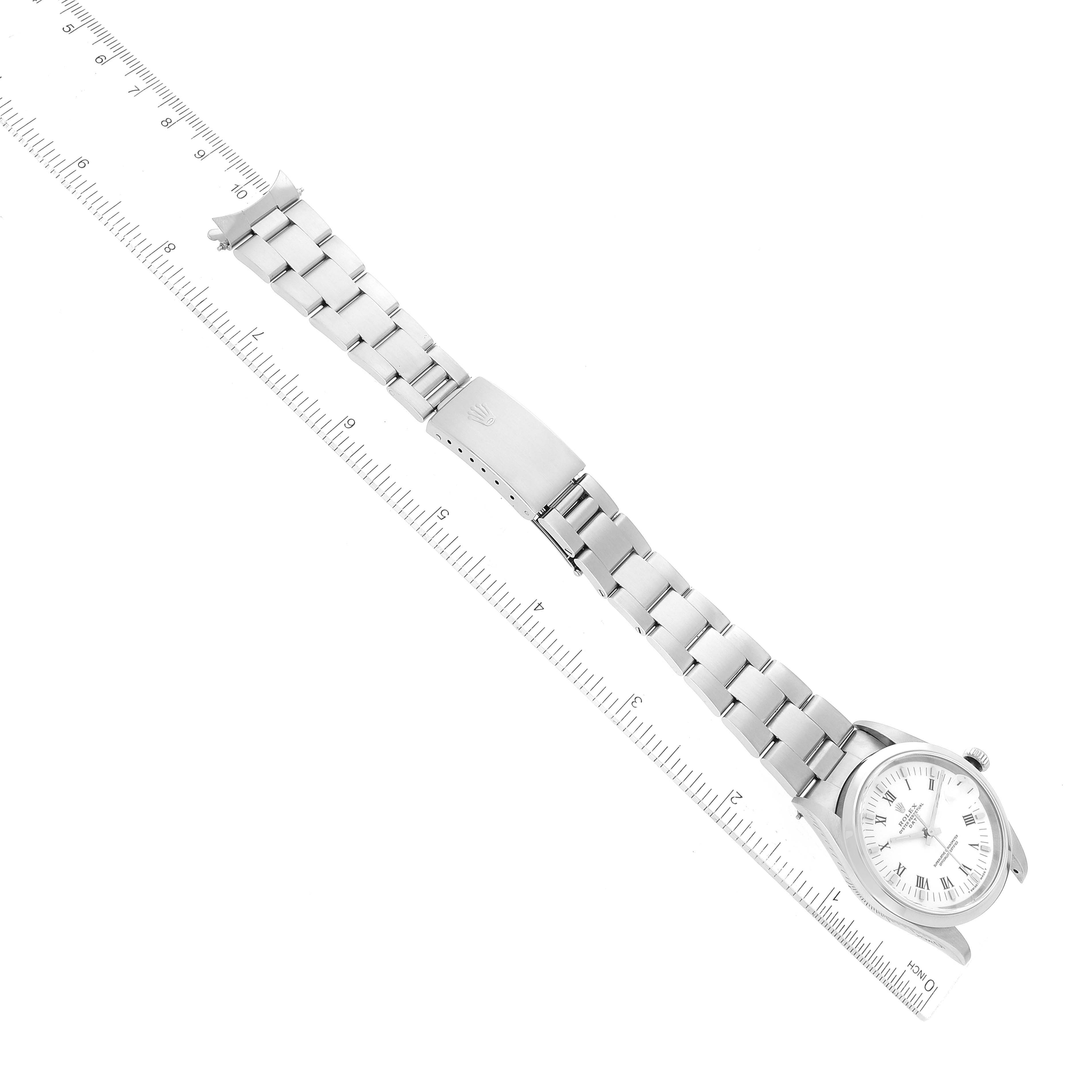 The image shows the entire Rolex Date 15200 Men's Stainless Steel White Dial 15200 Men's Stainless Steel White Dial model watch laying flat with a ruler alongside for scale.