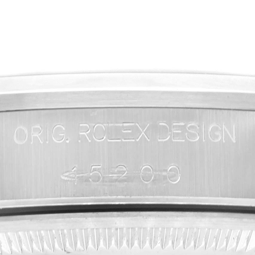 The image shows the case back with engravings, including "ORIG. ROLEX DESIGN" and the model number of a Rolex Date 15200 Men's Stainless Steel White Dial 15200 Men's Stainless Steel White Dial watch.