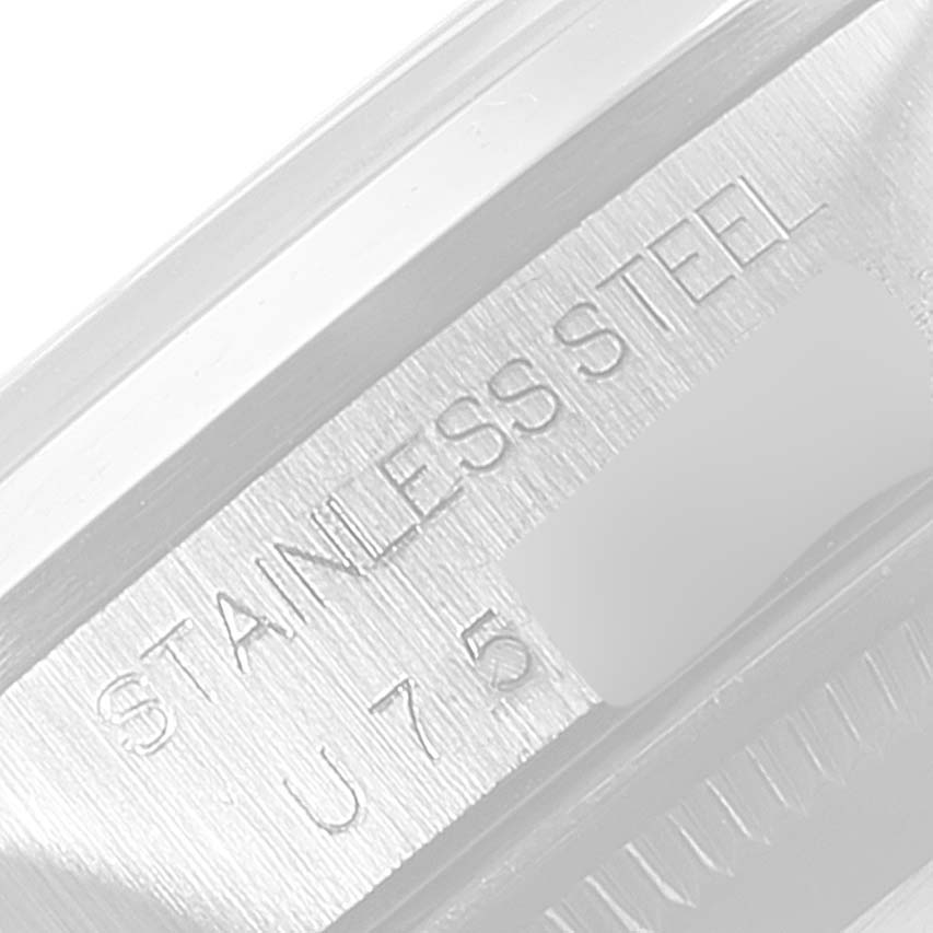 The image shows a close-up of the engraved stainless steel text on the bezel of a Rolex Date 15200 Men's Stainless Steel Pink Dial 15200 Men's Stainless Steel Pink Dial model watch.