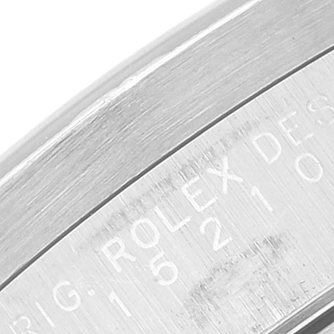 This close-up image shows the engraved side of a Rolex Date 15210 Men's Stainless Steel Silver Dial 15210 Men's Stainless Steel Silver Dial model watch case.