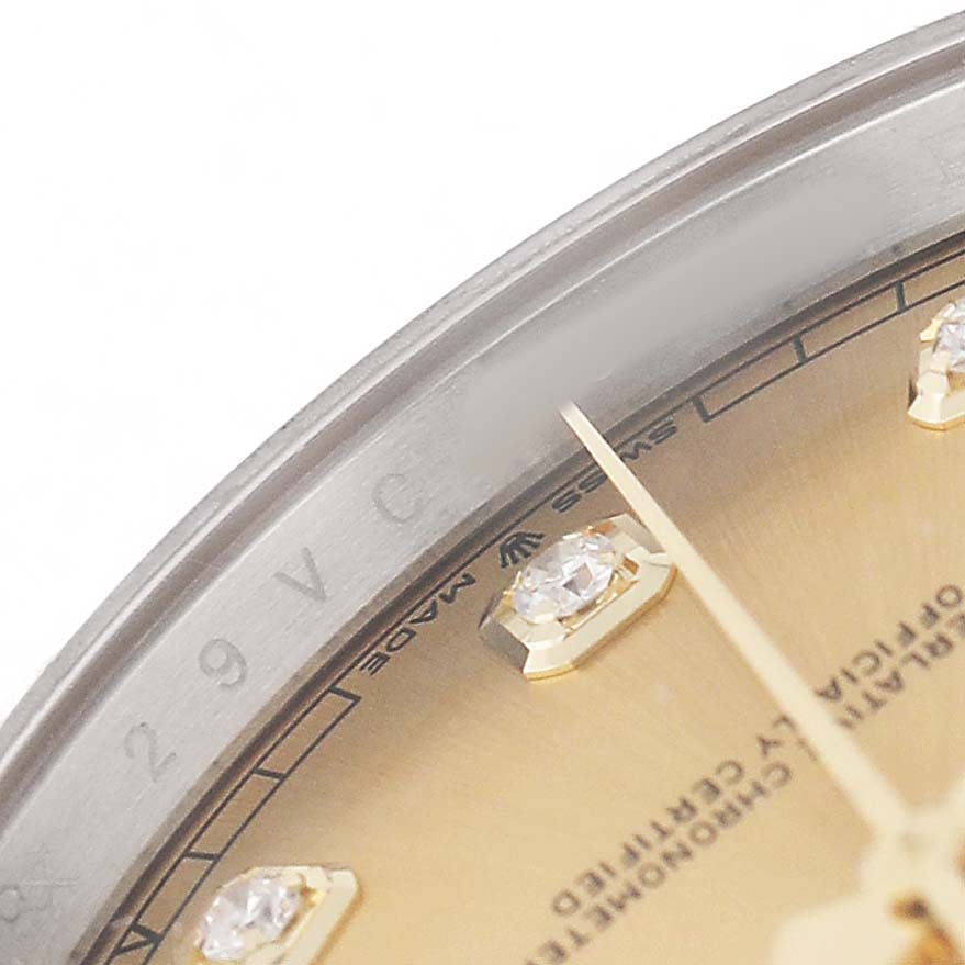 The image shows a close-up of the Rolex Datejust 41 126333 Men's Steel and Gold (two tone) Champagne Dial, displaying part of the dial with diamond markers and the edge of the bezel.