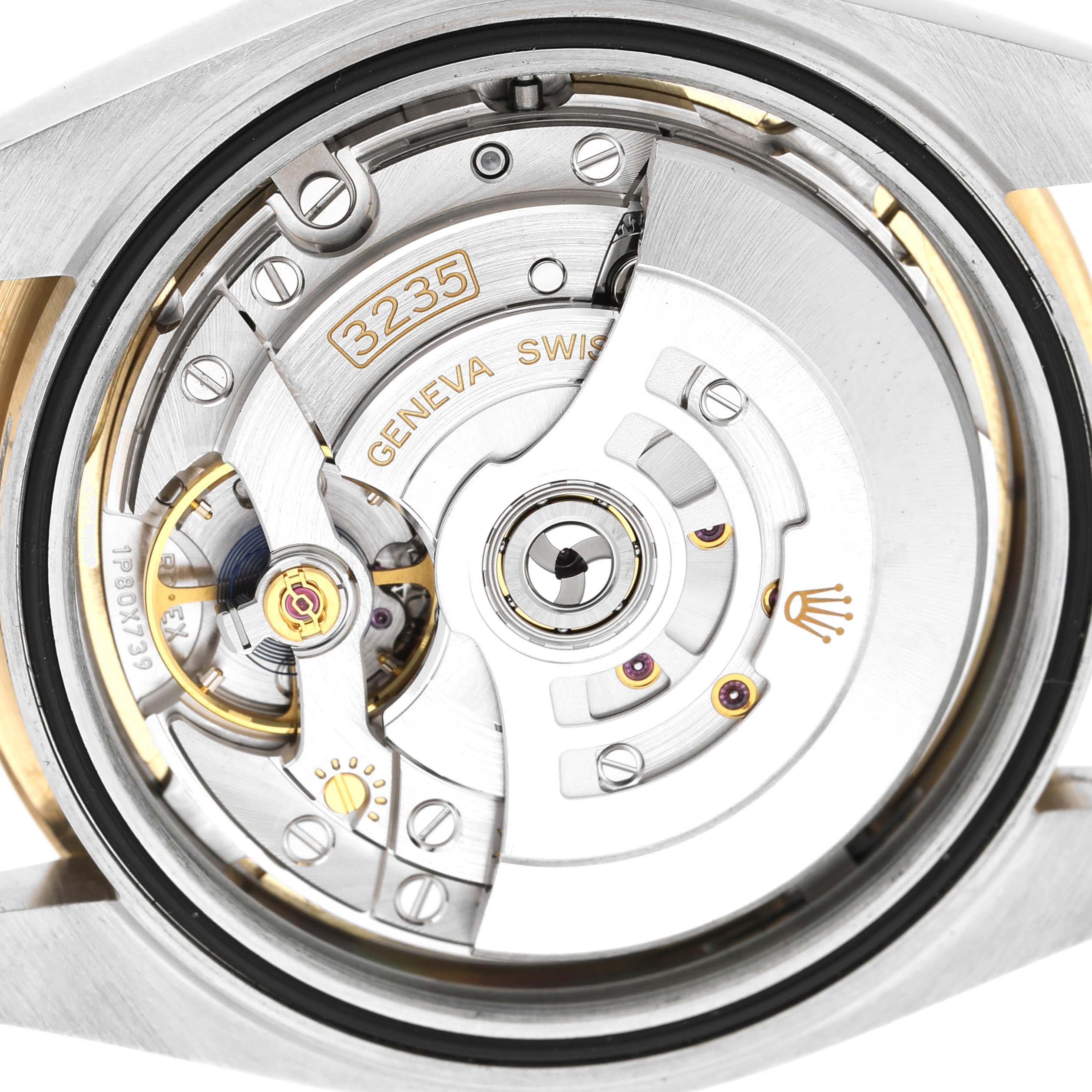 The image shows the movement of a Rolex Datejust 41 126333 Men's Steel and Gold (two tone) Champagne Dial watch, highlighting the intricate mechanical components and rotor.