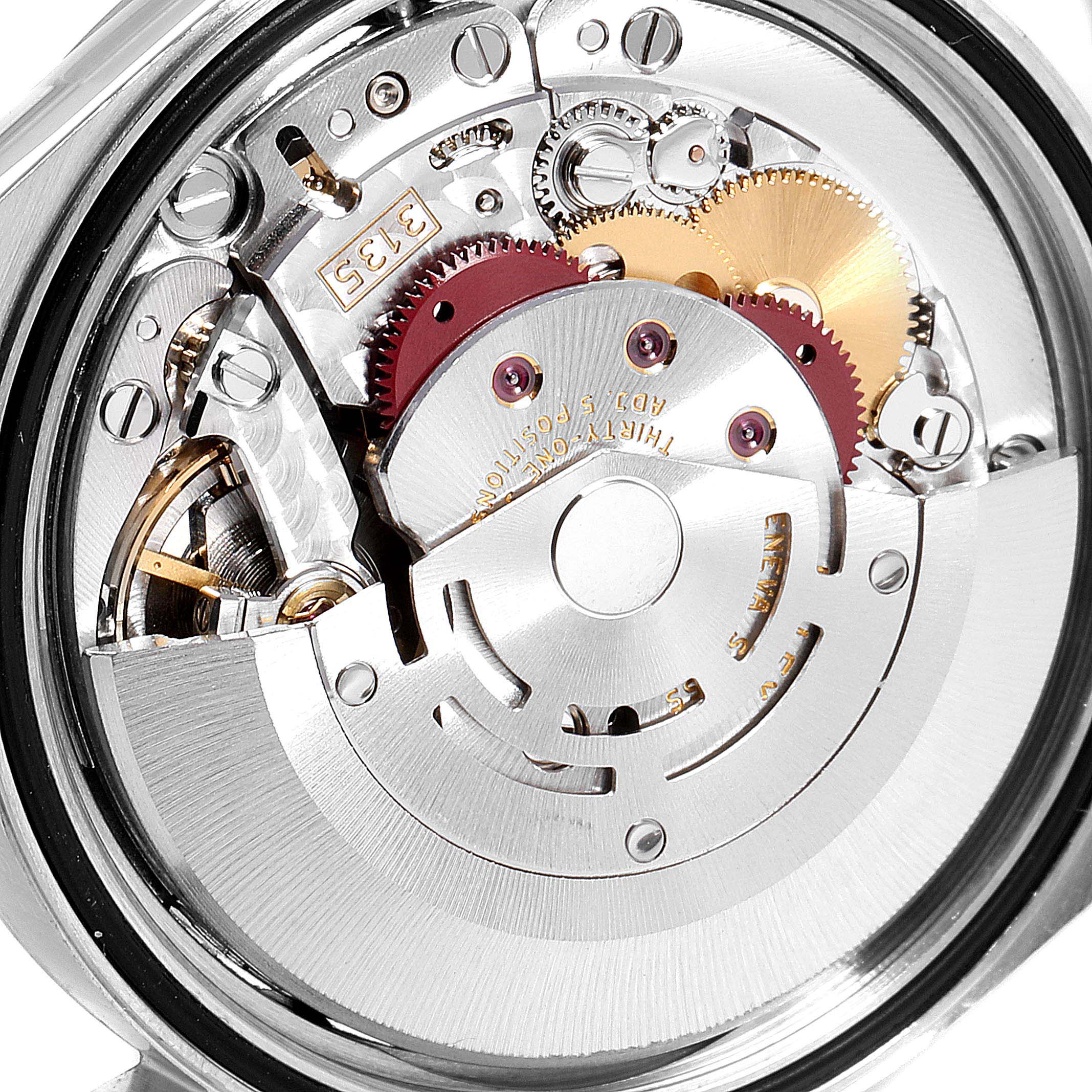The image shows an angled view of the inner mechanical movement of a Rolex Datejust 16200 Men's Stainless Steel Silver Dial 16200 Men's Stainless Steel Silver Dial watch, highlighting gears and components.