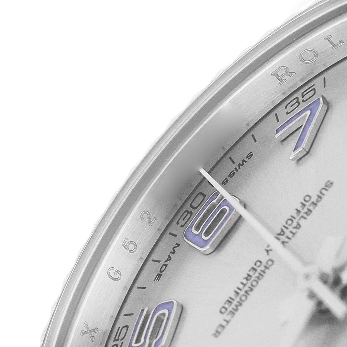 This image shows a close-up of the dial and edge of the bezel of a Rolex Datejust 41 116334 Men's Stainless Steel Silver Dial, highlighting the numerals and minute markers.