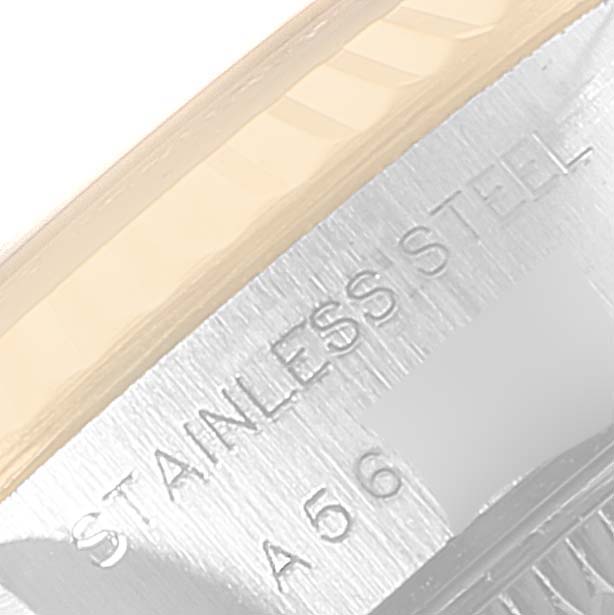 This close-up image shows the stainless steel casing with engravings of the Rolex Datejust 79173 Women's Steel and Gold (two tone) Blue Dial 79173 Women's Steel and Gold (two tone) Blue Dial watch.