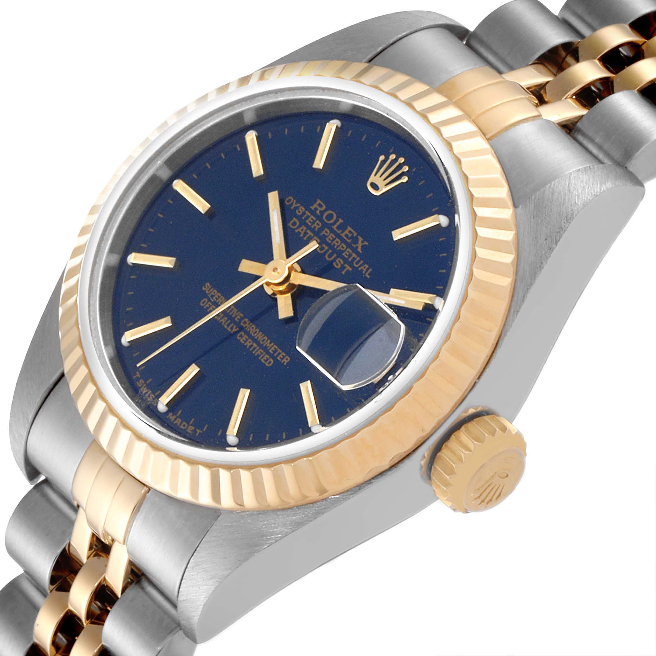 The image shows a side angle view of a Rolex Datejust 79173 Women's Steel and Gold (two tone) Blue Dial 79173 Women's Steel and Gold (two tone) Blue Dial watch, highlighting the crown, bezel, bracelet, and dial.