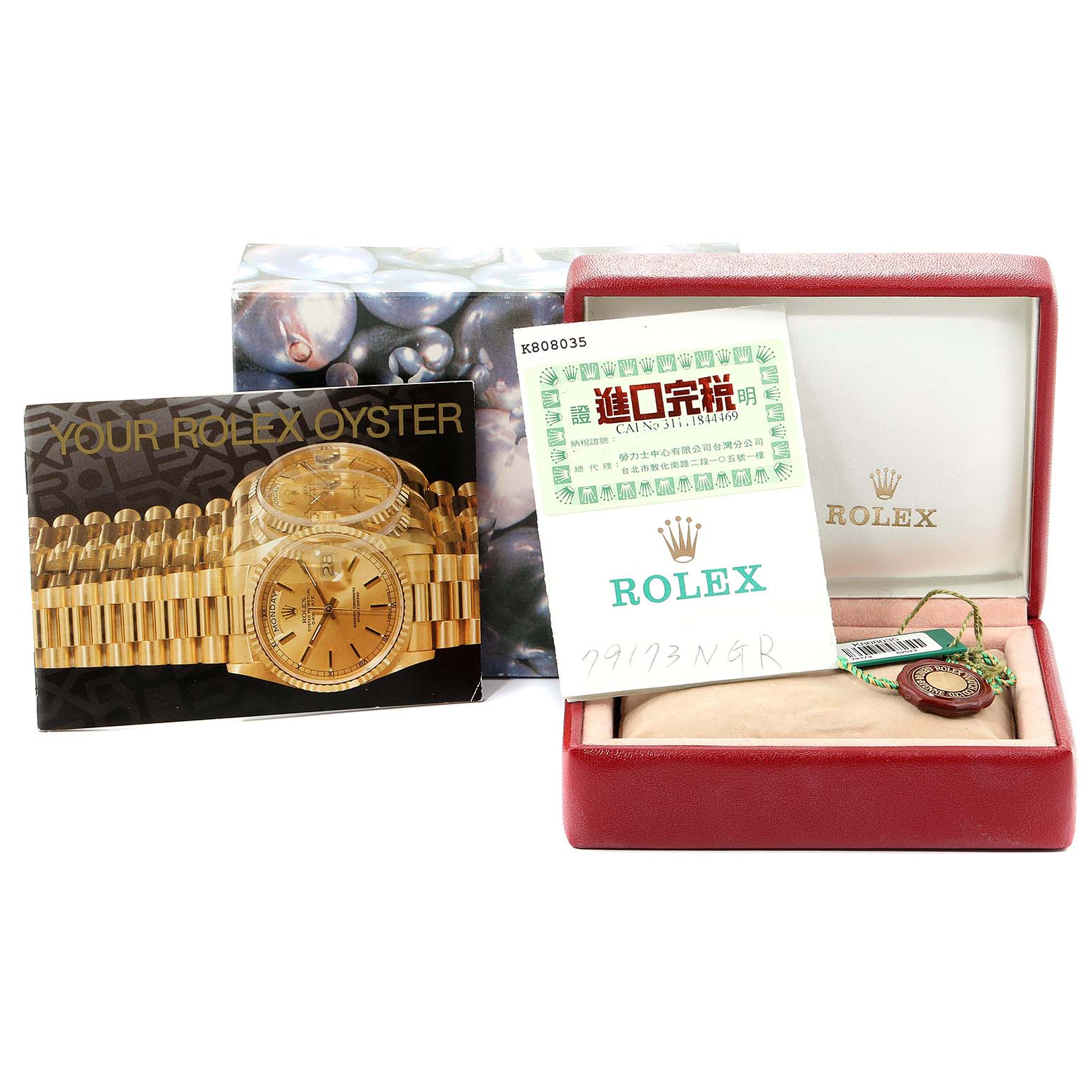 The image shows the packaging, booklets, and accessories for a Rolex Datejust 79173 Women
s Steel and Gold (two tone) Mother of Pearl Dial 79173 Women
s Steel and Gold (two tone) Mother of Pearl Dial watch.