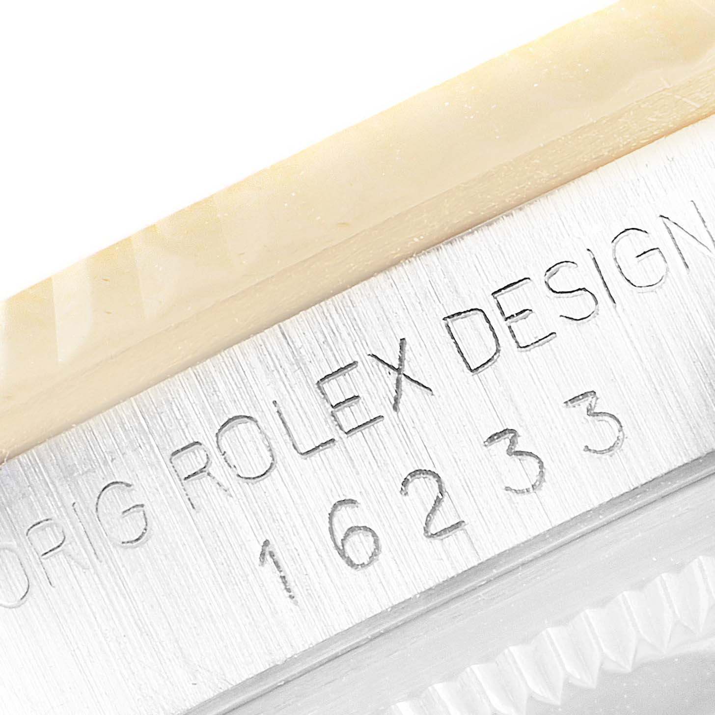 This close-up shows the side of a Rolex Datejust 16233 Men's Steel and Gold (two tone) White Dial 16233 Men's Steel and Gold (two tone) White Dial watch, revealing the model number "16233" engraved on the case.