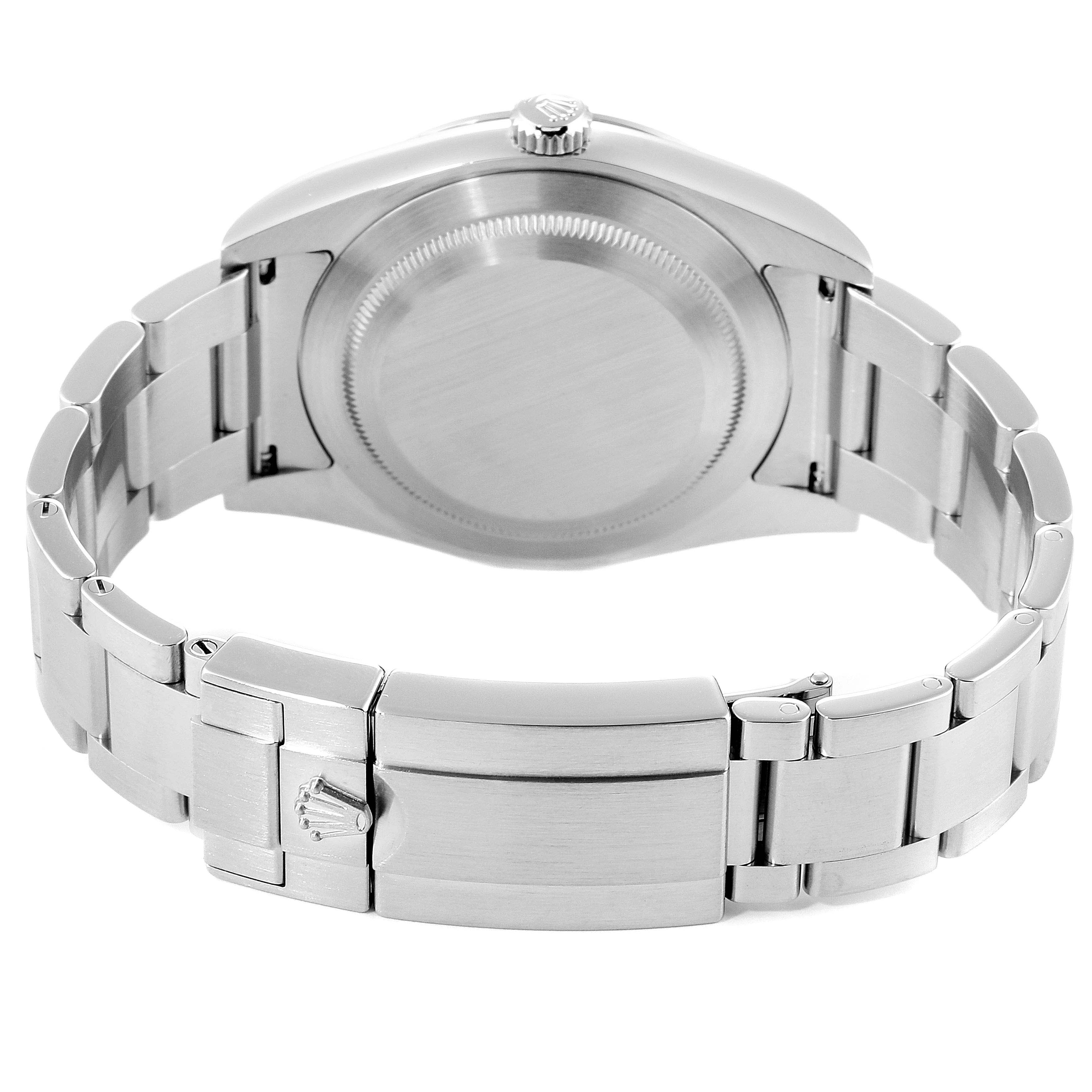 The image shows the back view of a Rolex Explorer 214270 Men
s Stainless Steel Black Dial 214270 Men
s Stainless Steel Black Dial watch, featuring its stainless steel bracelet and case.