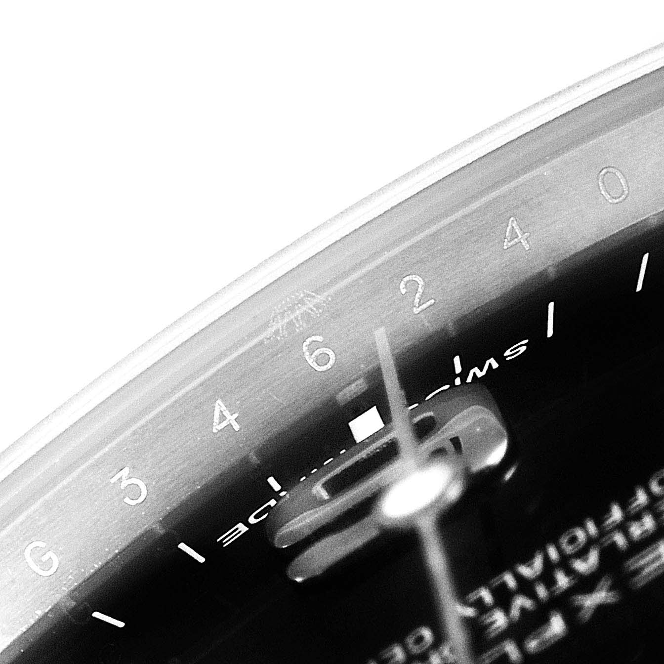 The image shows a close-up angle of the dial and rotating bezel of the Rolex Explorer 214270 Men
s Stainless Steel Black Dial 214270 Men
s Stainless Steel Black Dial watch, focusing on the number markers.