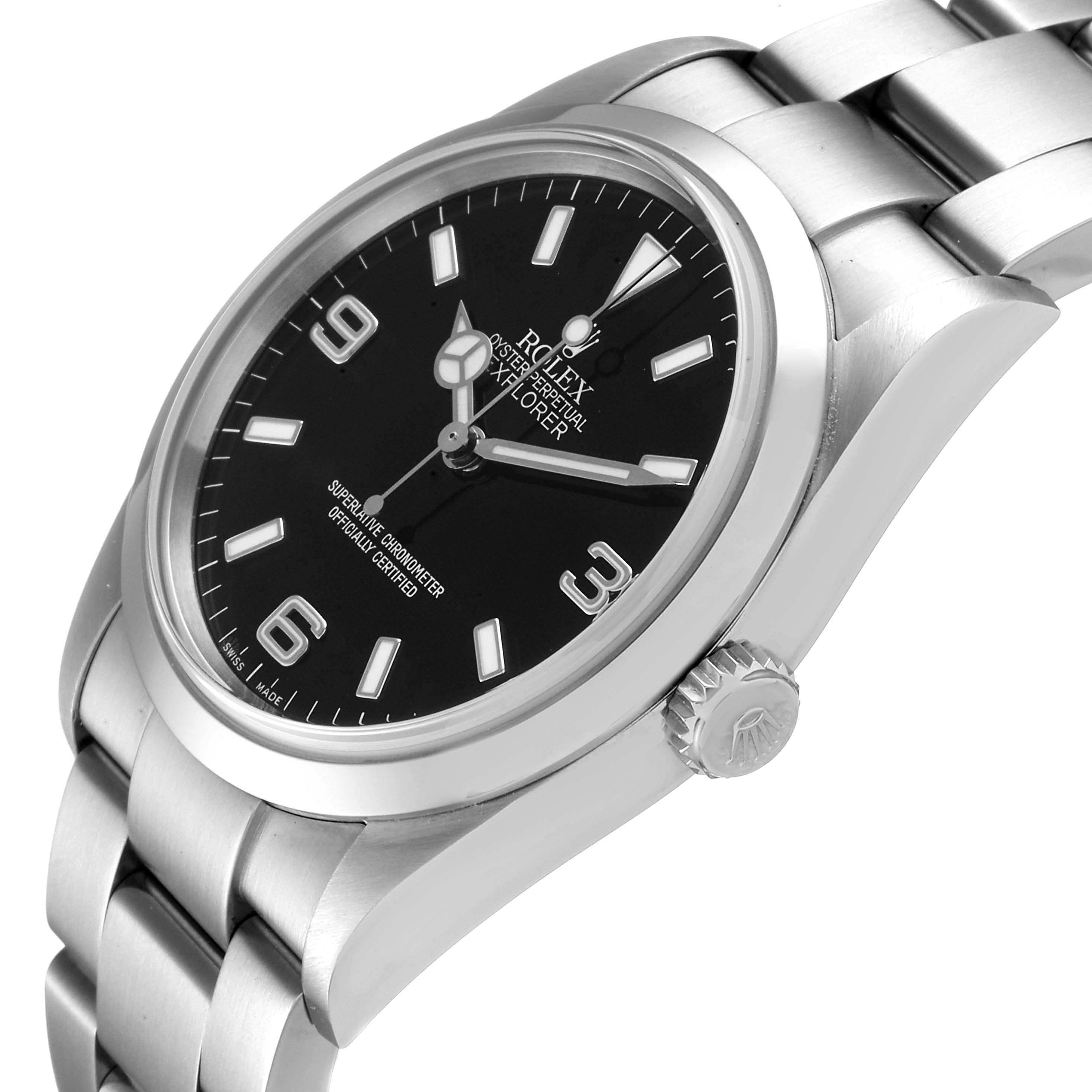 The image shows a side angle of the Rolex Explorer 114270 Men
s Stainless Steel Black Dial 114270 Men
s Stainless Steel Black Dial watch, highlighting its black dial, crown, and stainless steel bracelet.