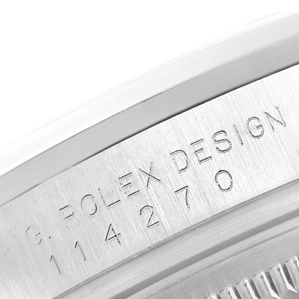 This image shows a close-up of the side casing of a Rolex Explorer 114270 Men
s Stainless Steel Black Dial 114270 Men
s Stainless Steel Black Dial, displaying the serial number engraved on it.