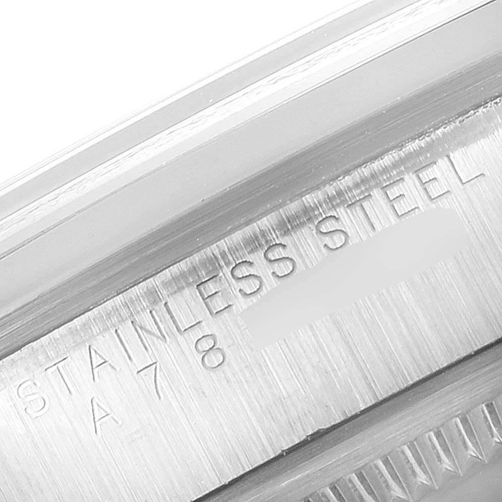 This close-up image shows the edge of the case and the reference number engraving on a Rolex Explorer 14270 Men's Stainless Steel Black Dial 14270 Men's Stainless Steel Black Dial model watch.