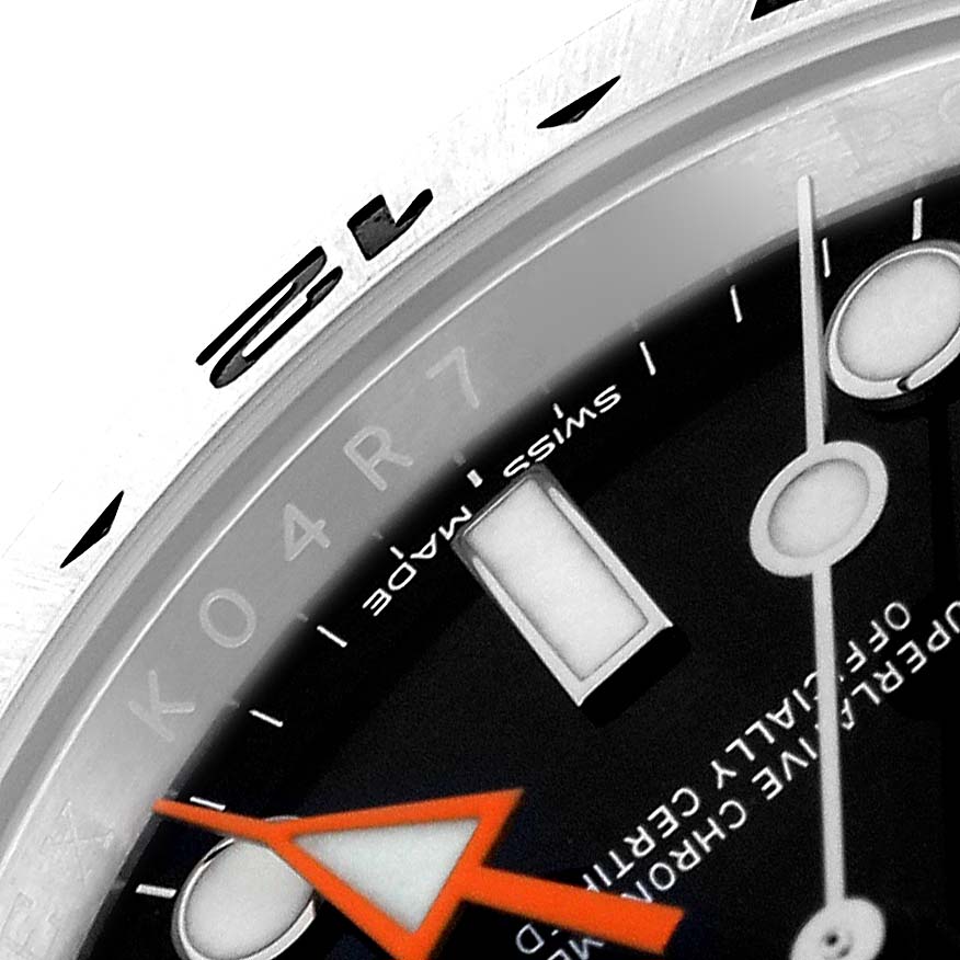 The image shows a close-up of the dial, bezel, and orange hand of the Rolex Explorer 216570 Men
s Stainless Steel Black Dial 216570 Men
s Stainless Steel Black Dial watch model.
