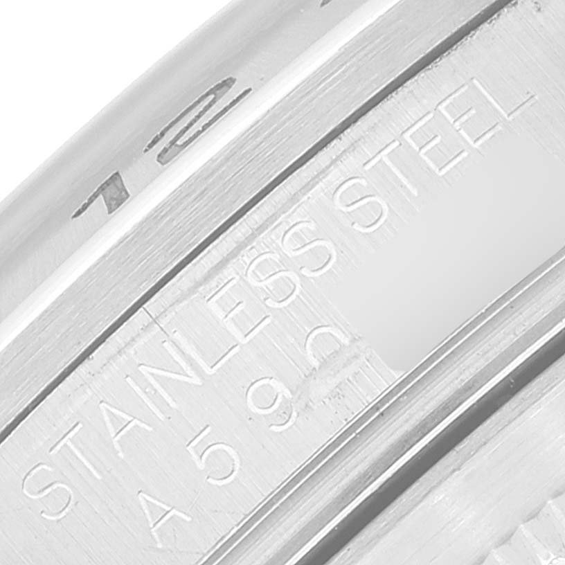This close-up image shows the engraved "STAINLESS STEEL" text and partial serial number on the side of the Rolex Explorer 16570 Men
s Stainless Steel Black Dial 16570 Men
s Stainless Steel Black Dial model watch.
