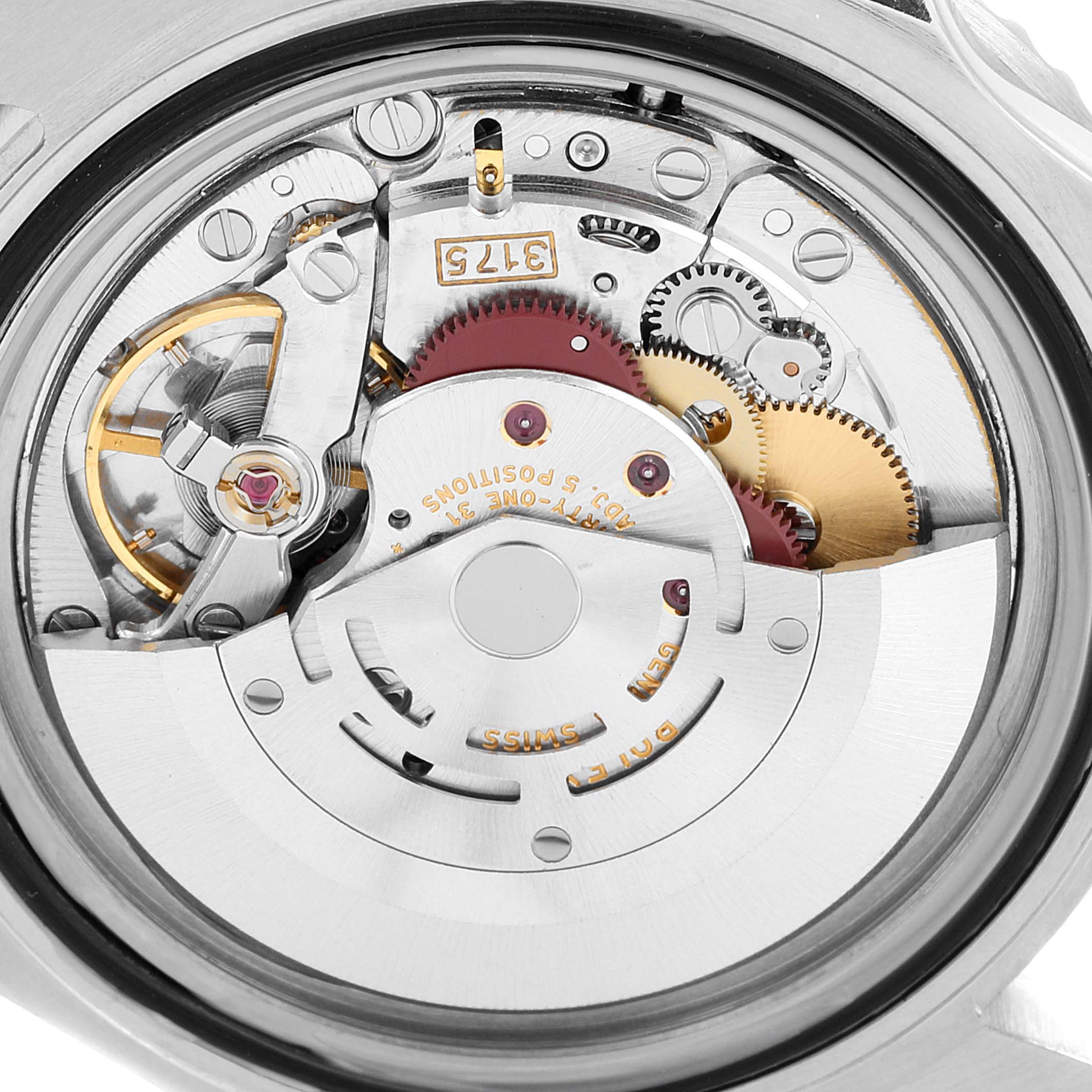 The image shows a close-up view of the movement and internal mechanisms of a Rolex GMT-Master 16700 Men
s Stainless Steel Black Dial 16700 Men
s Stainless Steel Black Dial watch.