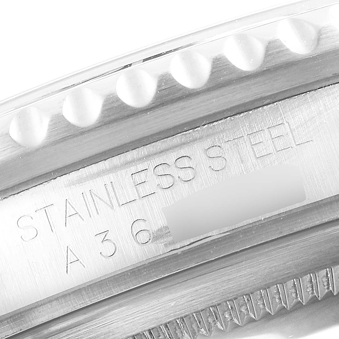 The image shows a close-up of the stainless steel case and bezel of a Rolex GMT-Master 16700 Men
s Stainless Steel Black Dial 16700 Men
s Stainless Steel Black Dial watch.