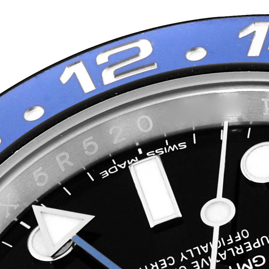 This image shows a close-up of the dial and bezel of a Rolex GMT-Master 116710BLNR Men
s Stainless Steel Black Dial 116710BLNR Men
s Stainless Steel Black Dial watch, highlighting some of the hour markers and the bezel numbers.