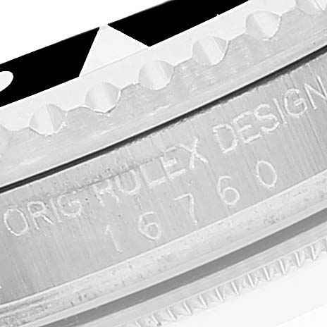 This image shows a close-up angle of the bezel and engravings on the side of a Rolex Vintage Collection 16760 Men's Stainless Steel Black Dial 16760 Men's Stainless Steel Black Dial model watch.