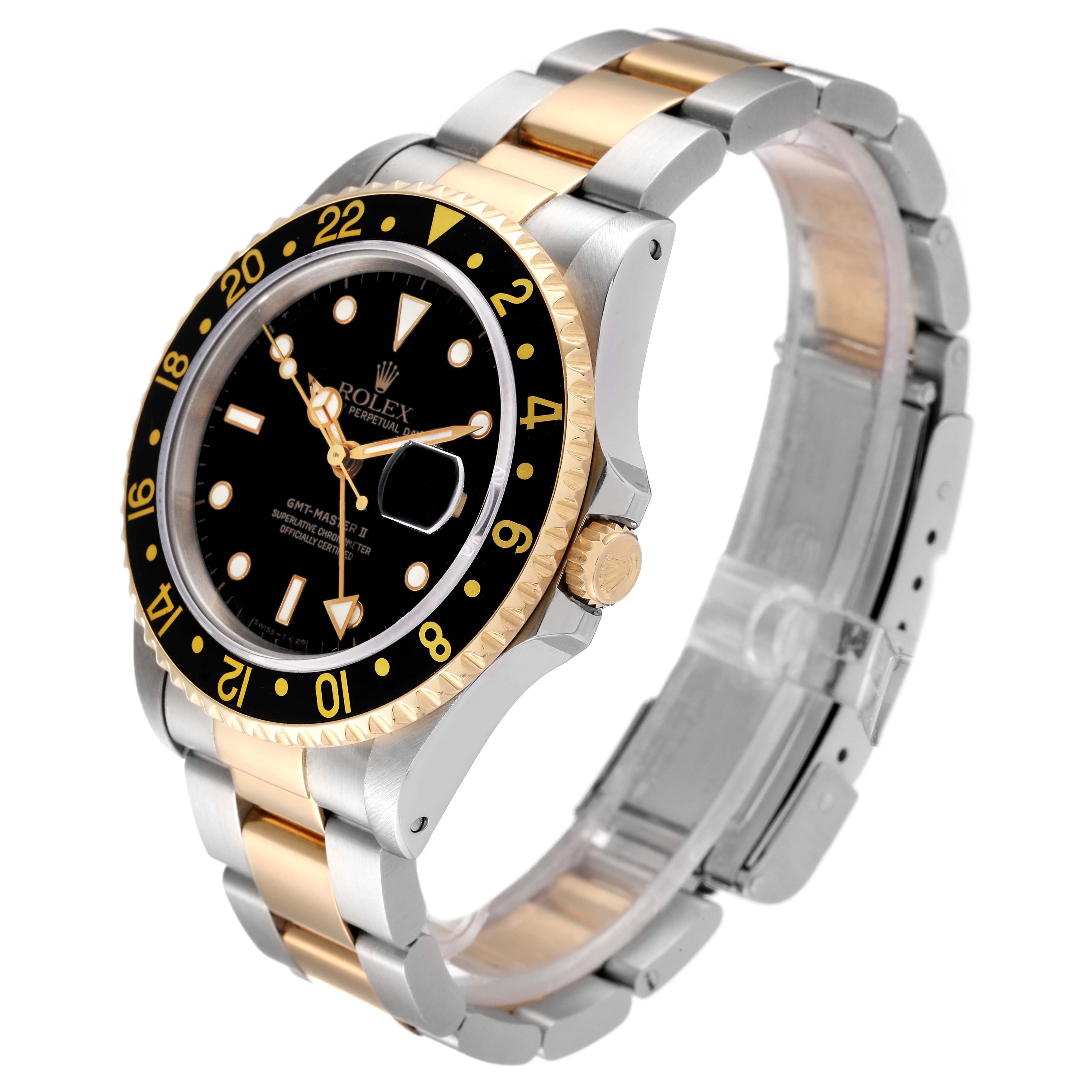 This image shows a Rolex GMT-Master 16713 Men's Steel and Gold (two tone) Black Dial 16713 Men's Steel and Gold (two tone) Black Dial watch at a three-quarter angle, highlighting the bezel, face, and bracelet.