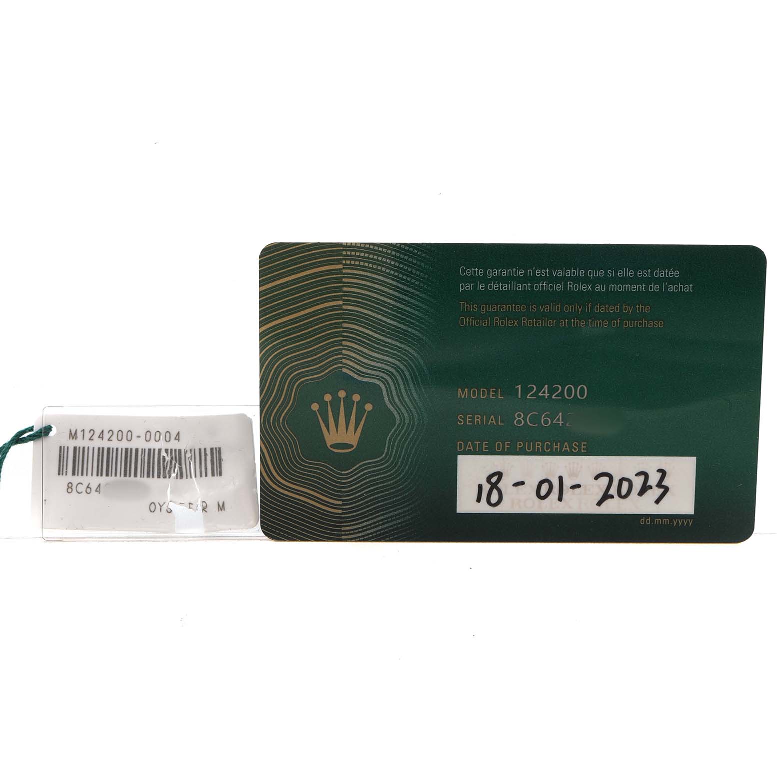 The image shows a guarantee card and tag for the Rolex Oyster Perpetual 124200 Women's Stainless Steel Pink Dial model 124200.