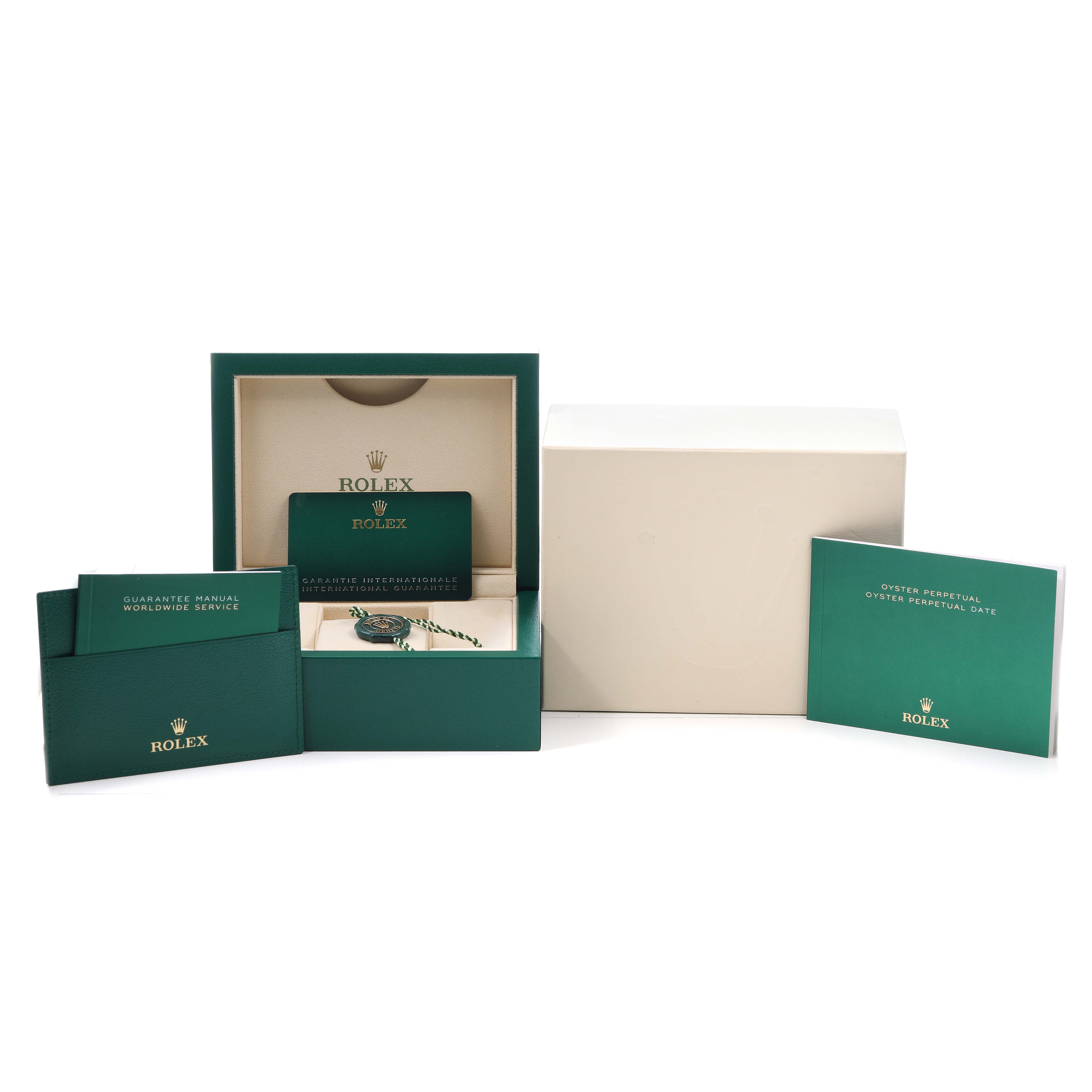 The image shows the Rolex Oyster Perpetual 134300 Men's Stainless Steel Beige Dial watch box, manuals, warranty card, and packaging accessories from a frontal angle.