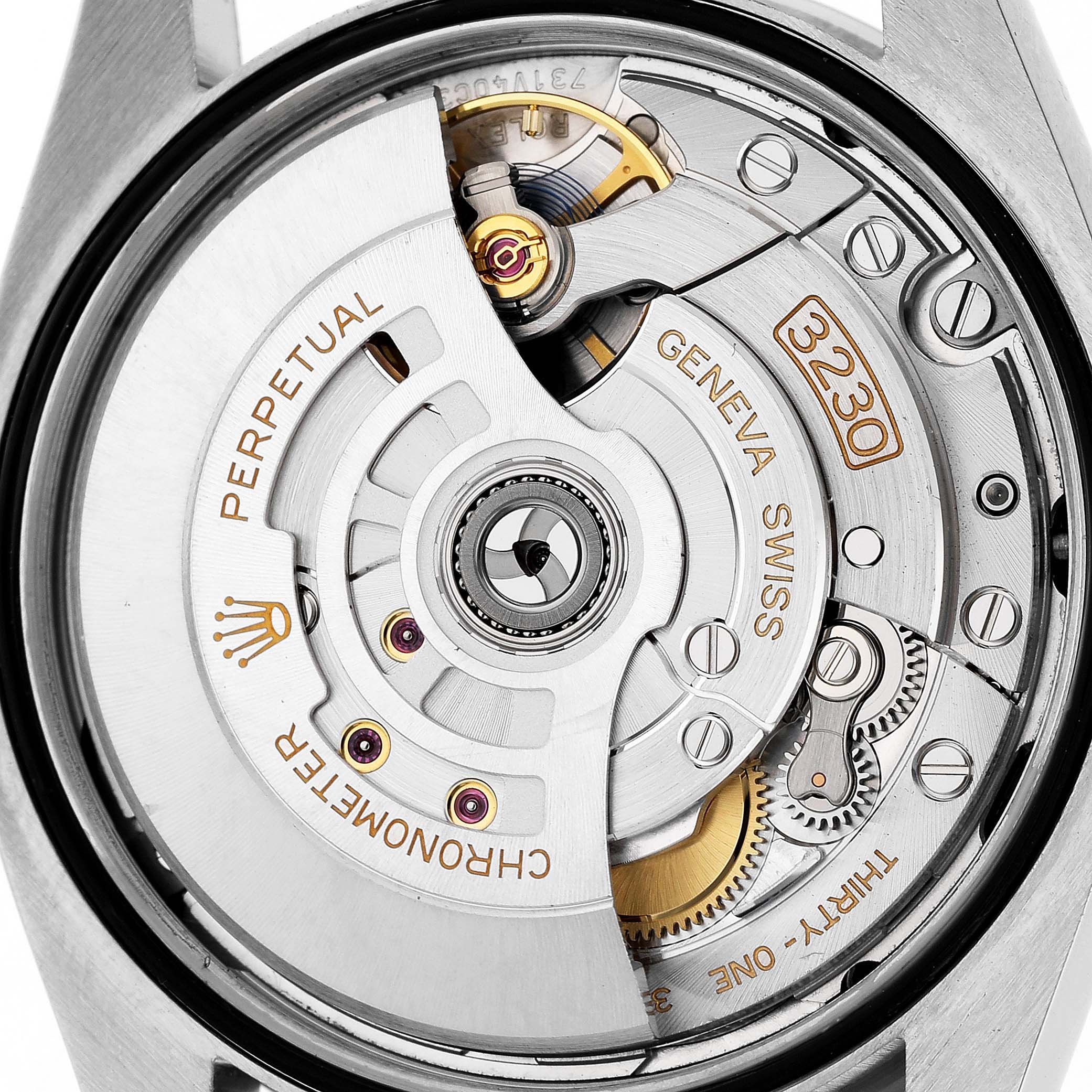 The image shows the movement of a Rolex Oyster Perpetual 126000 Men's Stainless Steel Blue Dial watch, highlighting gears and the rotor from the back.