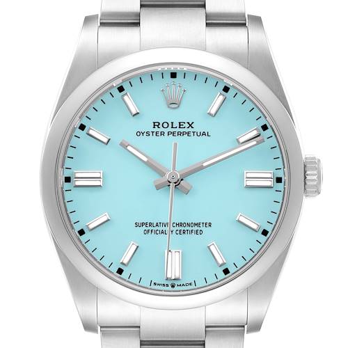 The image shows a front view of a Rolex Oyster Perpetual 126000 Men's Stainless Steel Blue Dial watch, highlighting the turquoise dial, crown, and bracelet.