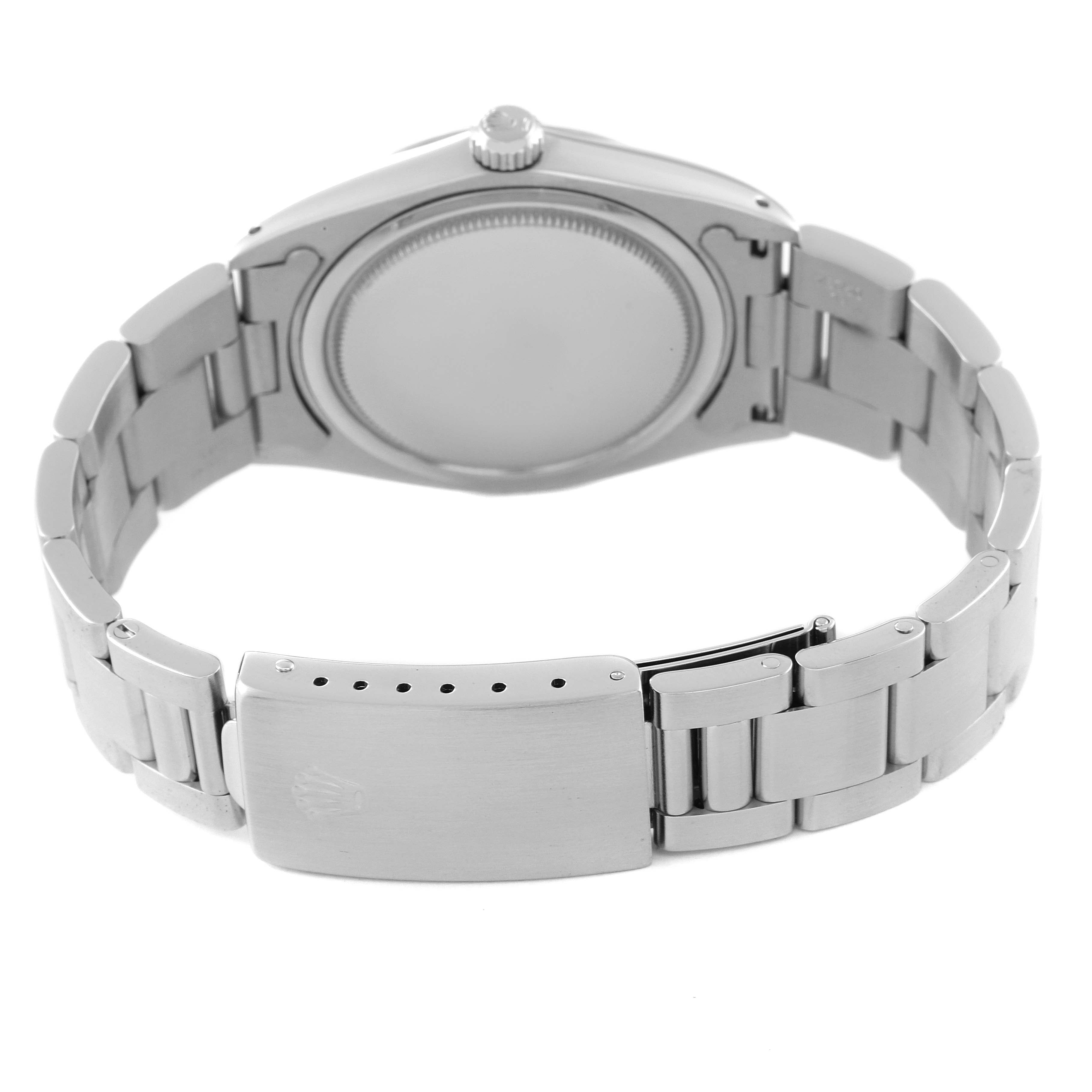 The image shows the back view of a Rolex Vintage Collection 6694 Men's Stainless Steel Silver Dial 6694 Men's Stainless Steel Silver Dial watch, highlighting the clasp, bracelet, and case back.