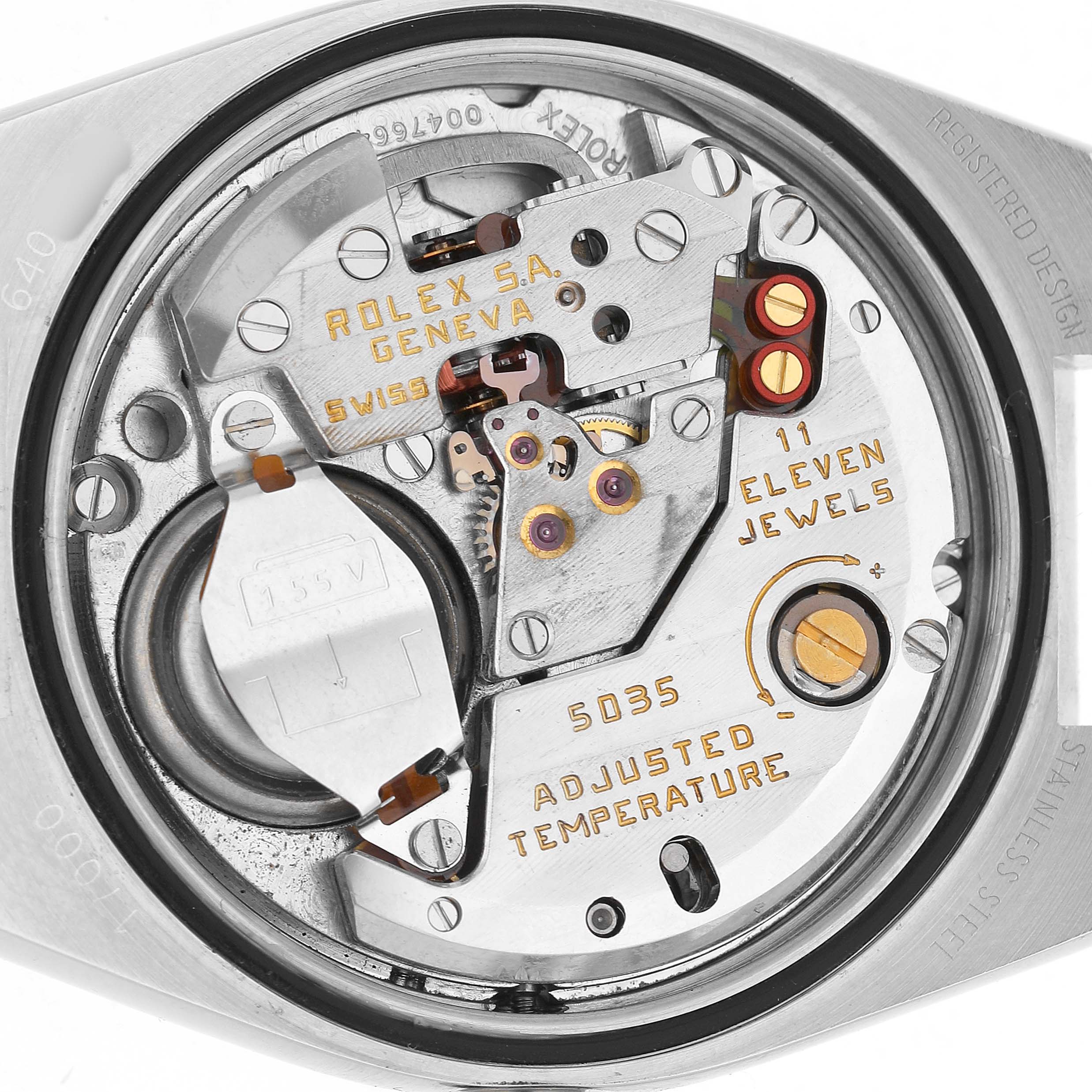 The image shows the movement of a Rolex Oysterquartz 17000 Men's Stainless Steel White Dial watch, highlighting its intricate inner mechanisms from a top-down angle.
